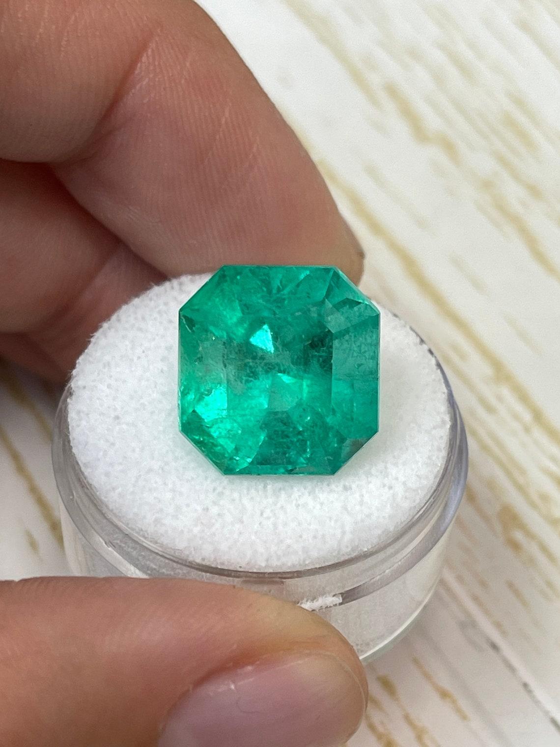 Stone: Emerald
Weight: 13.46-carats
Shape: Asscher Cut
Clarity: Transparent
Luster: Very Good
Color: Vibrant Yellowish Green
Measurements: 14.49mm x 13.81mm x 11.33mm
Geographic Origin: Colombia
Treatment: Natural, Minor Oil

Comments: Due to their