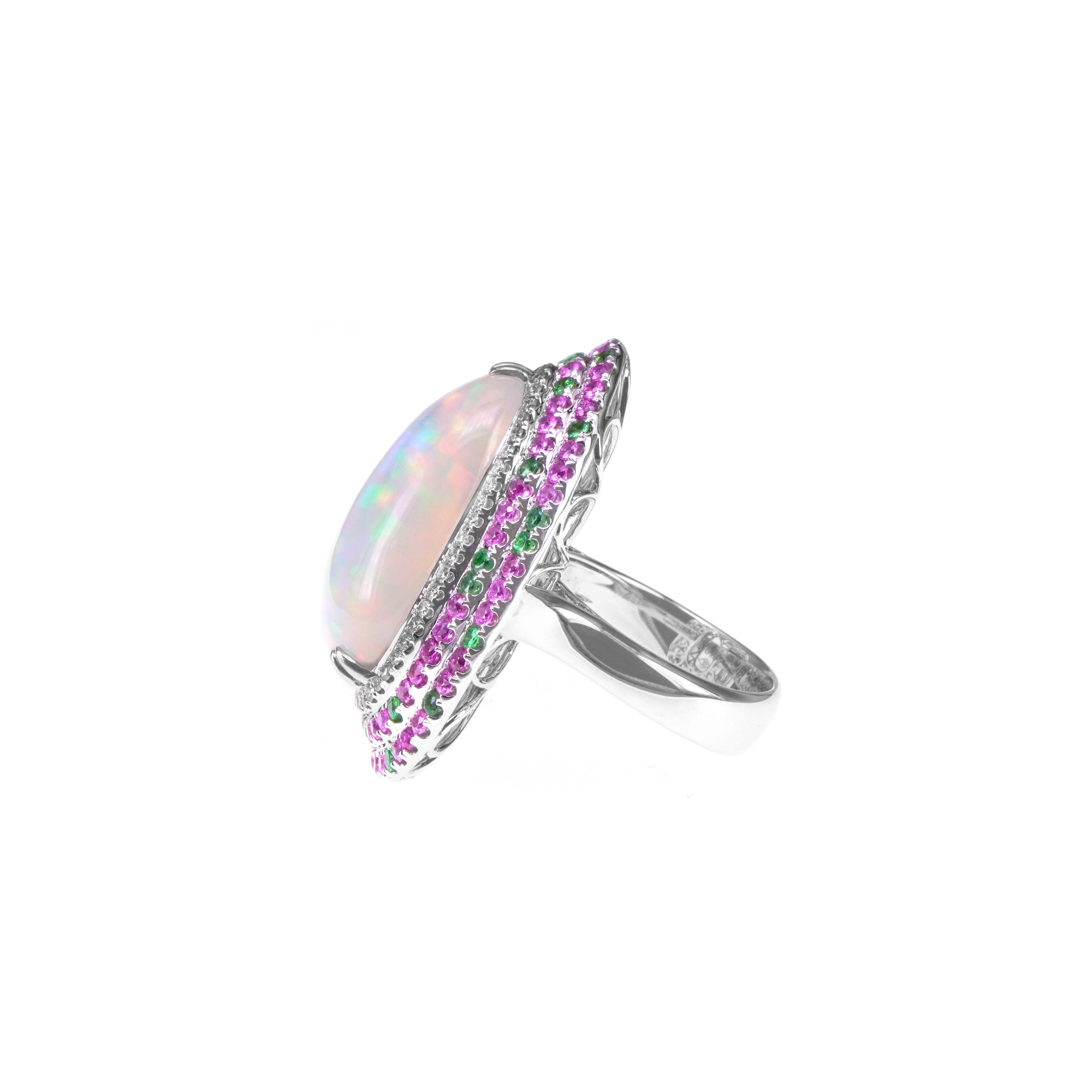 A cocktail of various stone, this ring consists of 13.48 carat of the best of Colorful pattern opal, 1.18 carat of vivid pink sapphire, 0.50 carat of vivid green Tsavorite and 0.31 carat of white round brilliant diamond. The details of the ring are