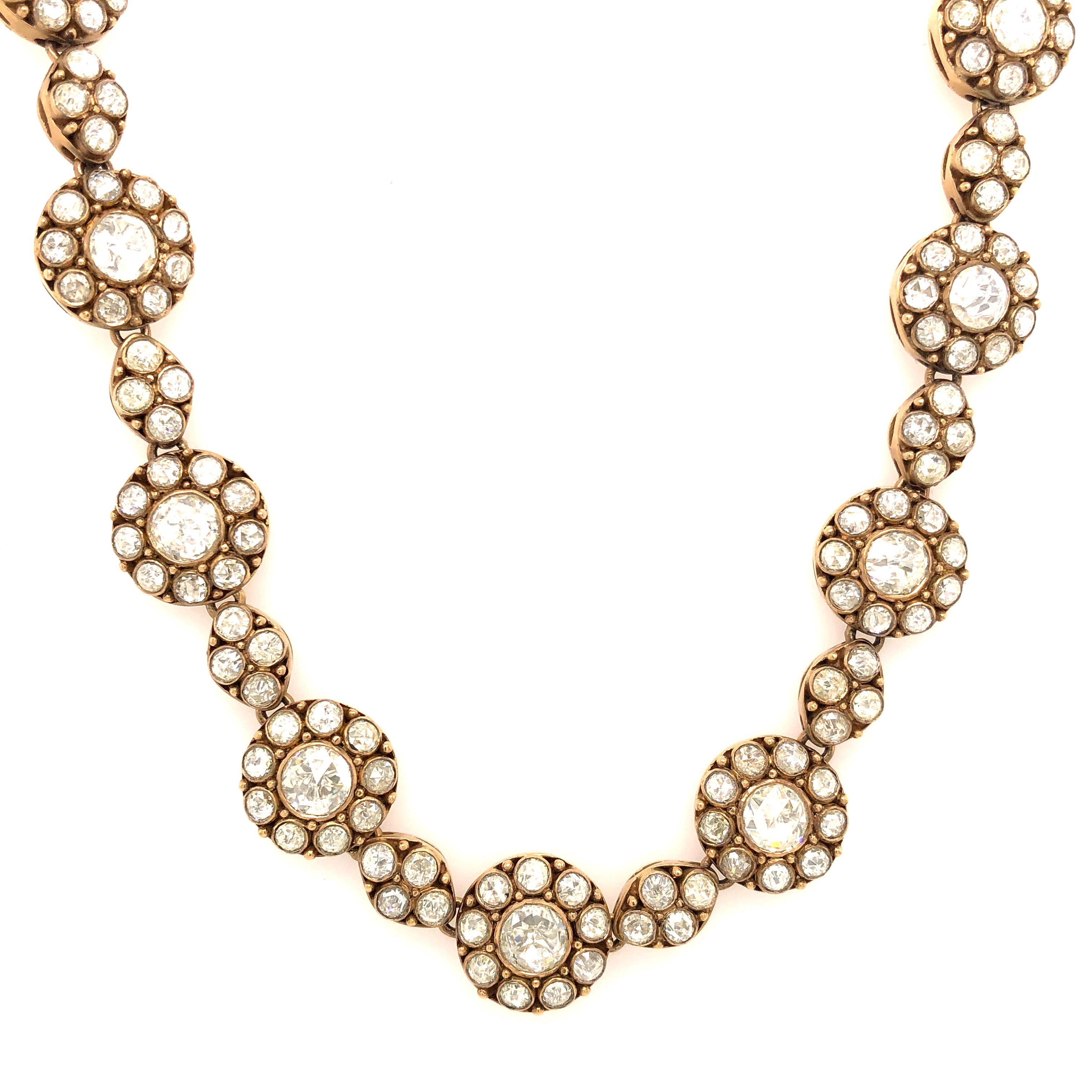  Handcrafted from 18-karat gold, this one-of-a-kind necklace is set with a dazzling array of round rosecut diamonds. This necklace is 15.5 inches long with a nice lobster clasp at the back. Wear it with a plunge-front dress or unbuttoned blouse.
