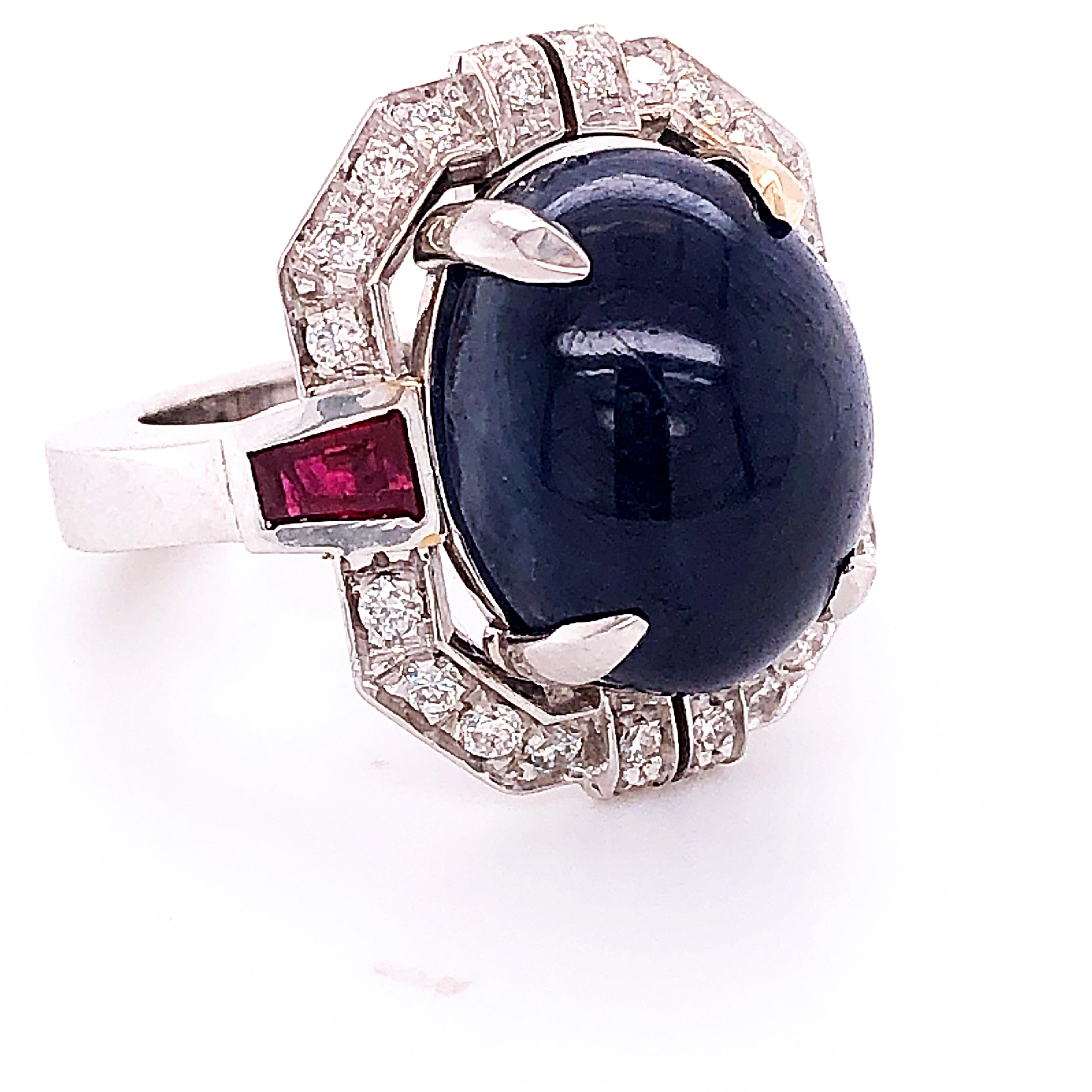 Contemporary Berca 13.48Kt Oval Sapphire Cabochon 0.42Kt Diamond 0.66Kt Ruby Cocktail Ring