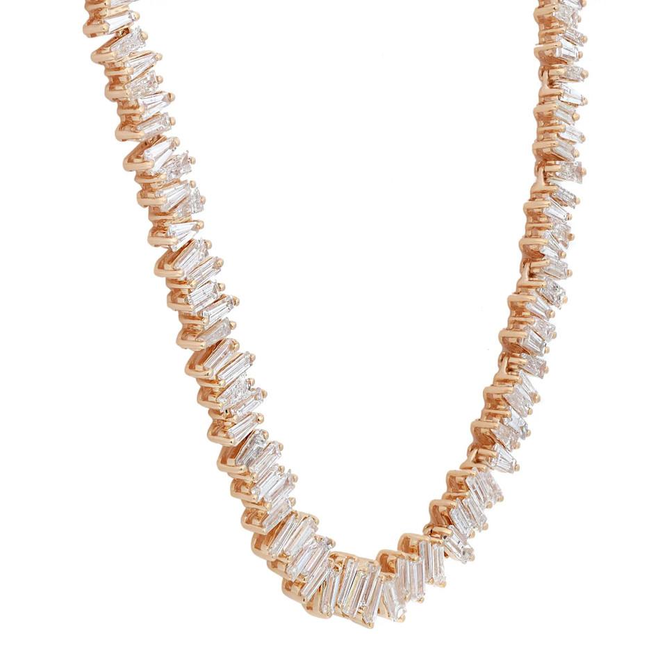 Introducing our stunning 13.49 Carat Classic Diamond Baguette Tennis Necklace in 18K Yellow Gold. This necklace is Elizabeth's original take on modernizing the classic tennis necklace. With over 13 carats of dazzling white diamond baguettes, it is a