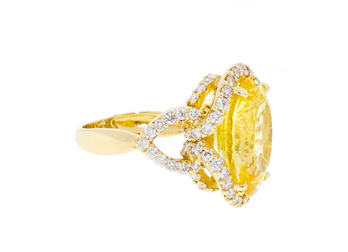 The gorgeous unheated oval-shaped sapphire looks astonishing on everybody as yellow is the color of joy and power. The elegant gem enhanced with brilliant cut diamonds is a great statement jewelry piece for elegant ladies.