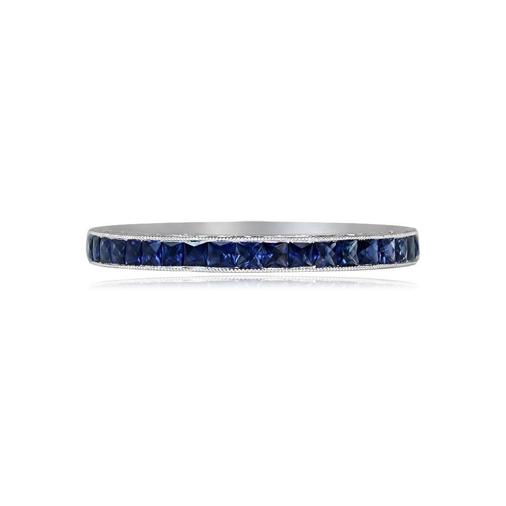 A stunning infinity band showcases natural French-cut blue sapphires with a total weight of approximately 1.34 carats, channel-set with intricate hand engravings along the sides. The band has a width of 2.20mm.

Ring Size: 7.5 US, Resizable
Metal:
