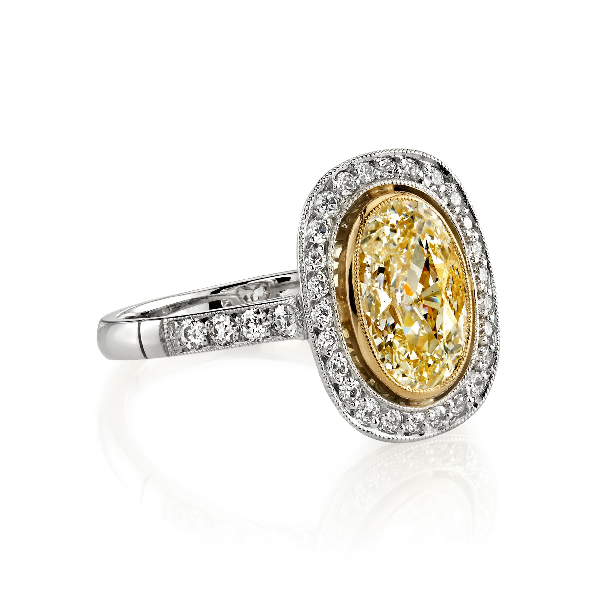 1.34ct H/VS2 GIA certified Oval cut diamond with 0.33ctw accent diamonds set in a handcrafted platinum and 18K yellow gold mounting. Ring is currently a size 6 and can be sized to fit. 