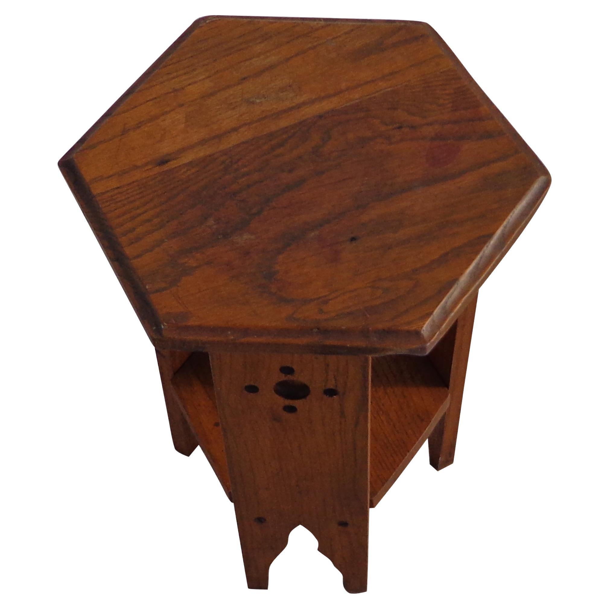 13.5? Arts & Crafts side table

Arts & Crafts octagonal top antique side table in oak featuring Moorish design elements.