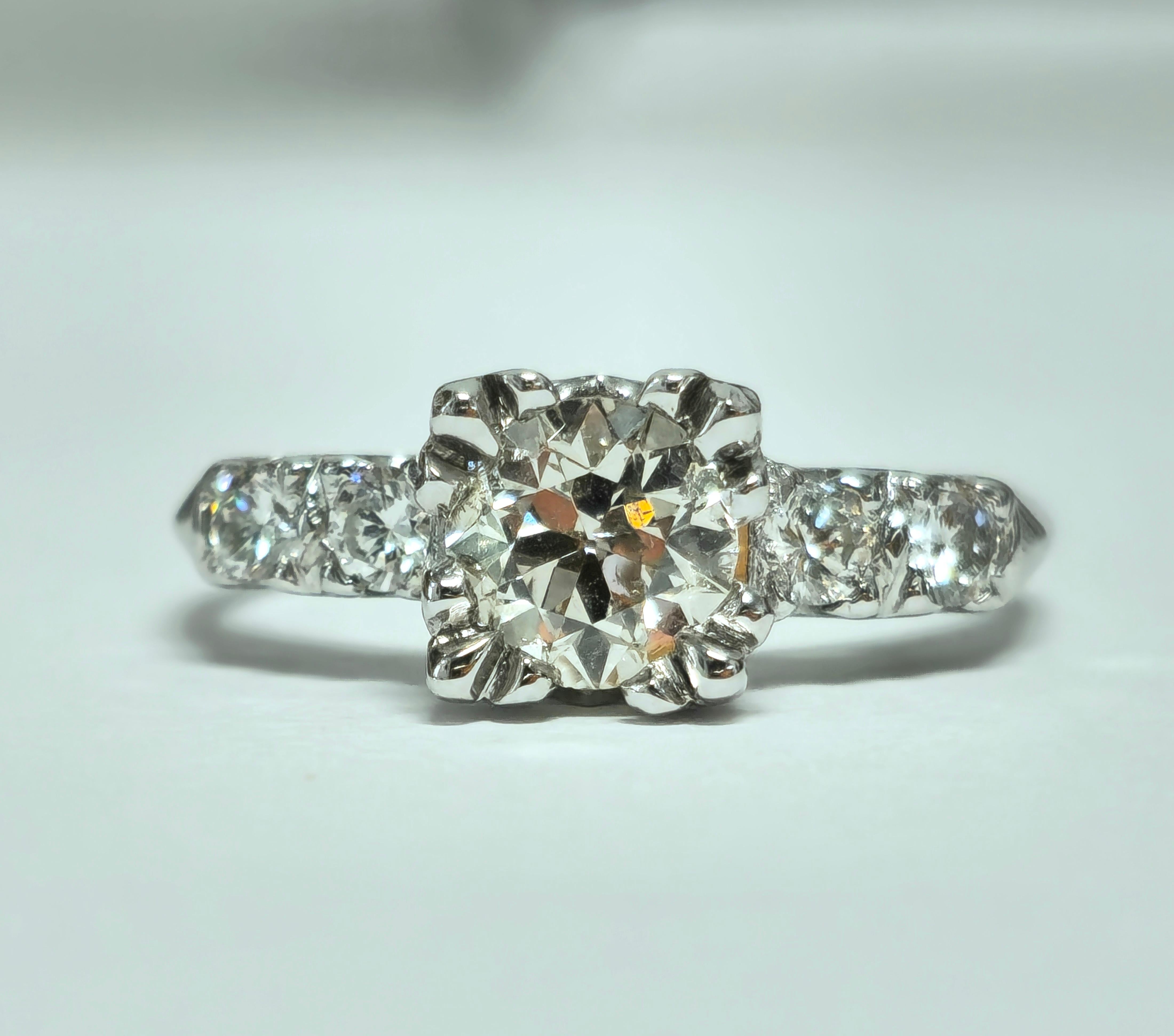 Step into timeless elegance with our breathtaking 14K White Gold Engagement Ring, adorned with a stunning 1.35 Carat center diamond. Complemented by side stones weighing 0.35 Carats, this exquisite ring exudes sophistication and grace, perfect for