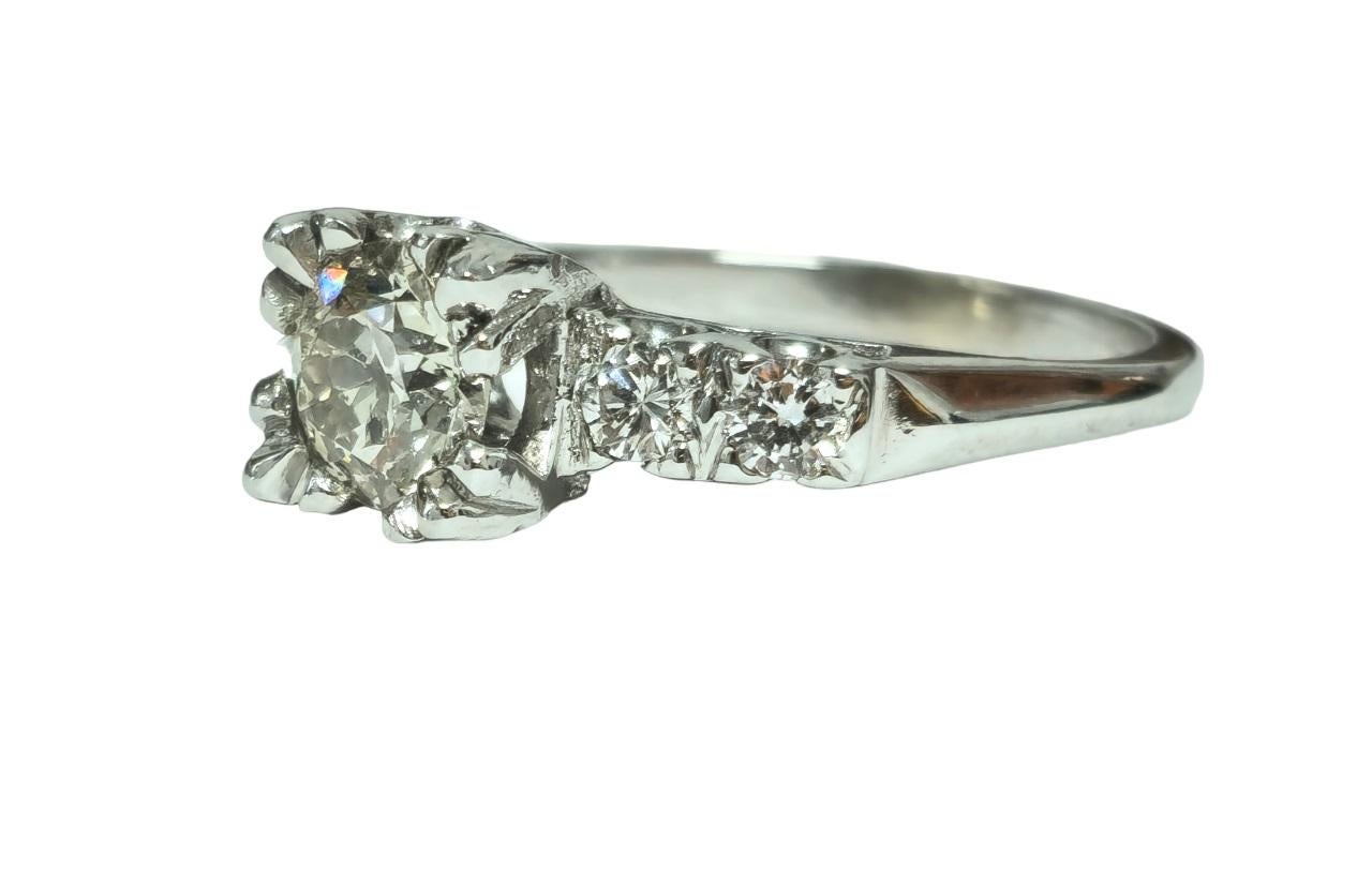 Step into timeless elegance with our breathtaking 14K White Gold Engagement Ring, adorned with a stunning 1.35 Carat center diamond. Complemented by side stones weighing 0.35 Carats, this exquisite ring exudes sophistication and grace, perfect for