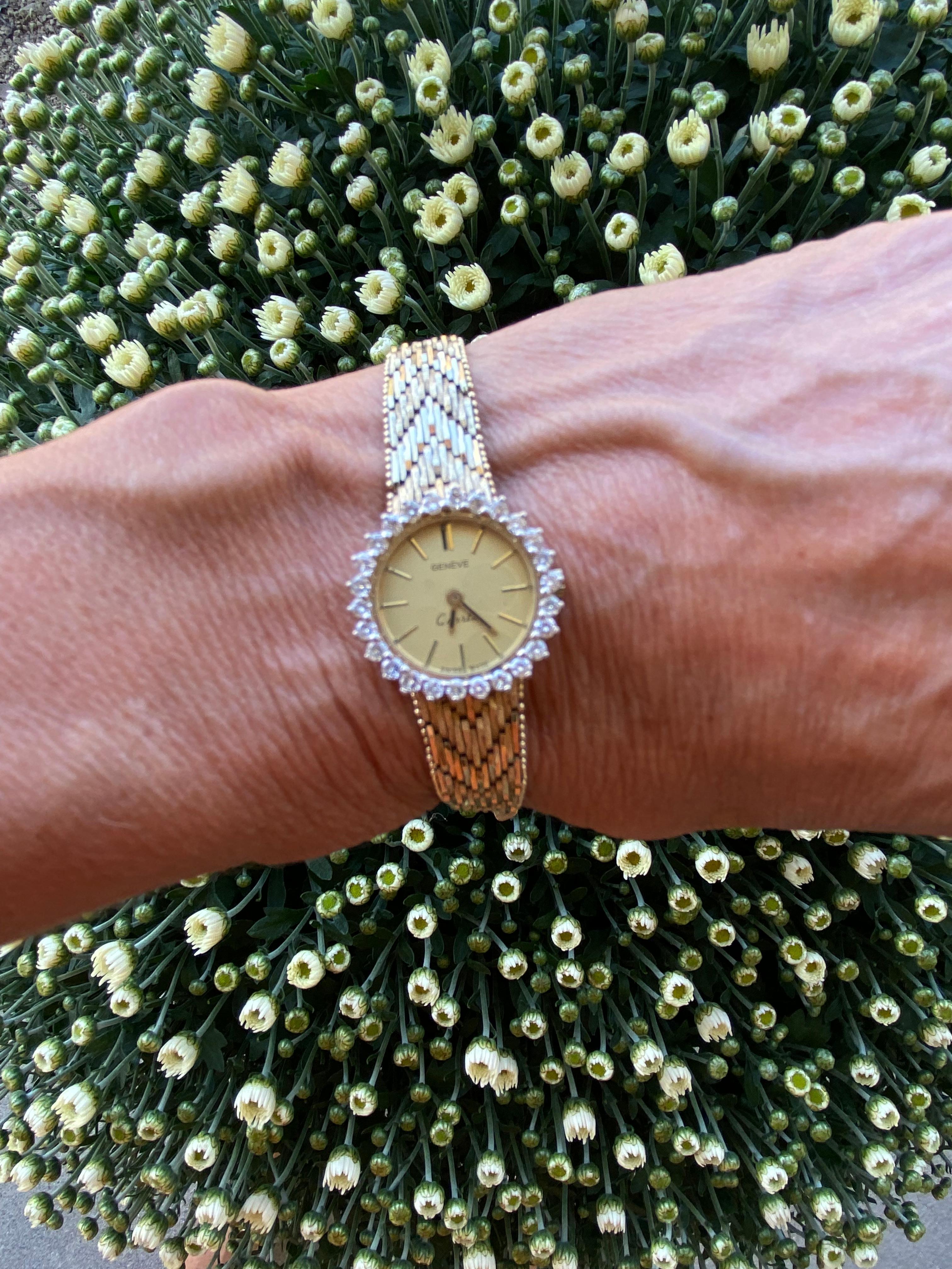 Geneva Quartz Diamond Ladies Watch surrounded by diamonds on a gold color dial measuring
22 mm.  
The gold color dial is with stick numbers. 
The strap is a heavy yellow gold 