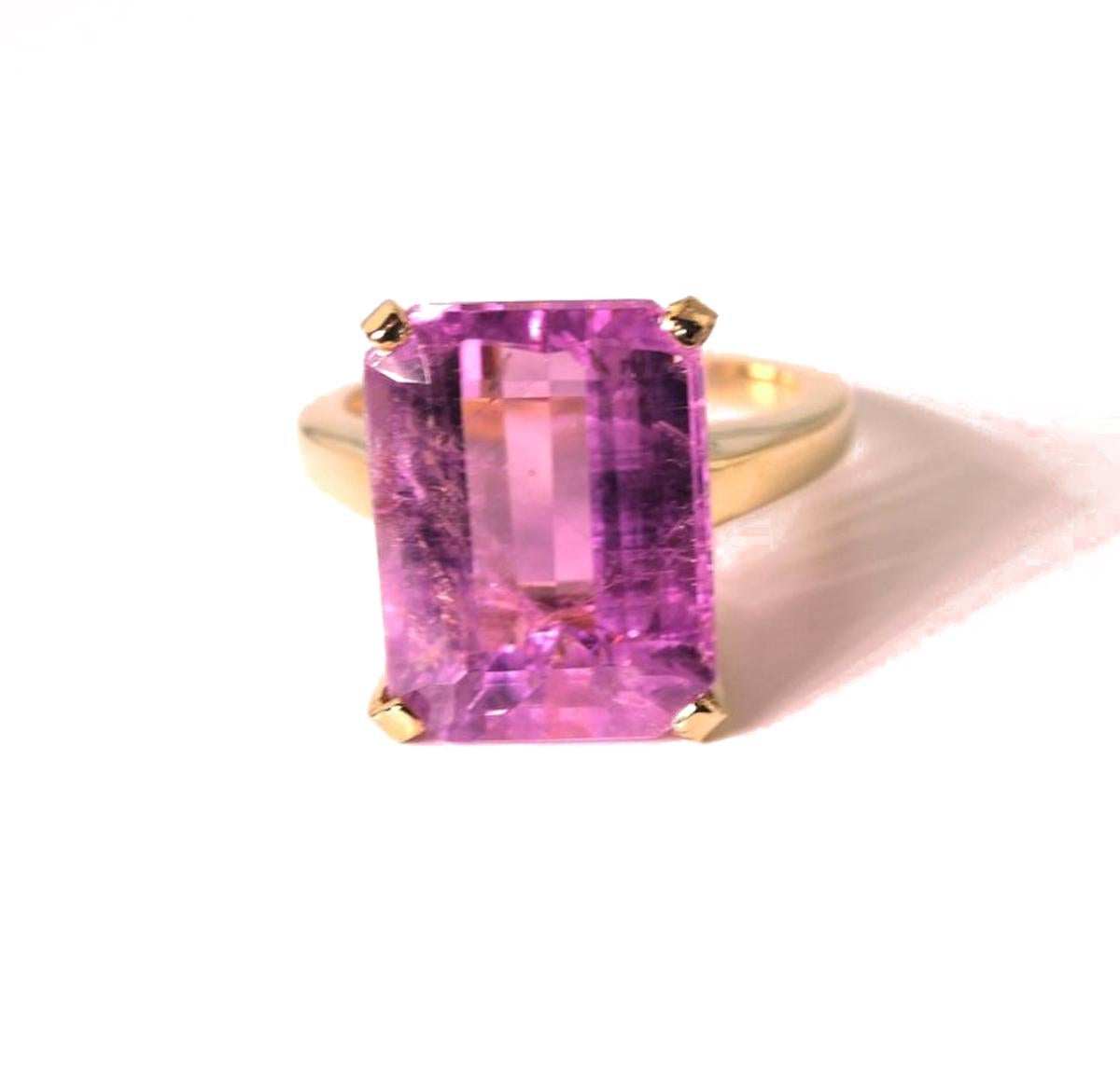 This gorgeous pinky purple 13.5 carat  Kunzite  is clear and glistening, set in a handmade unique 14Kt yellow Gold ring.  The ring is a  size 7 (sizable).  The gemstone measures 15 mm x 12 mm and is truly magnificent.   More from this seller by