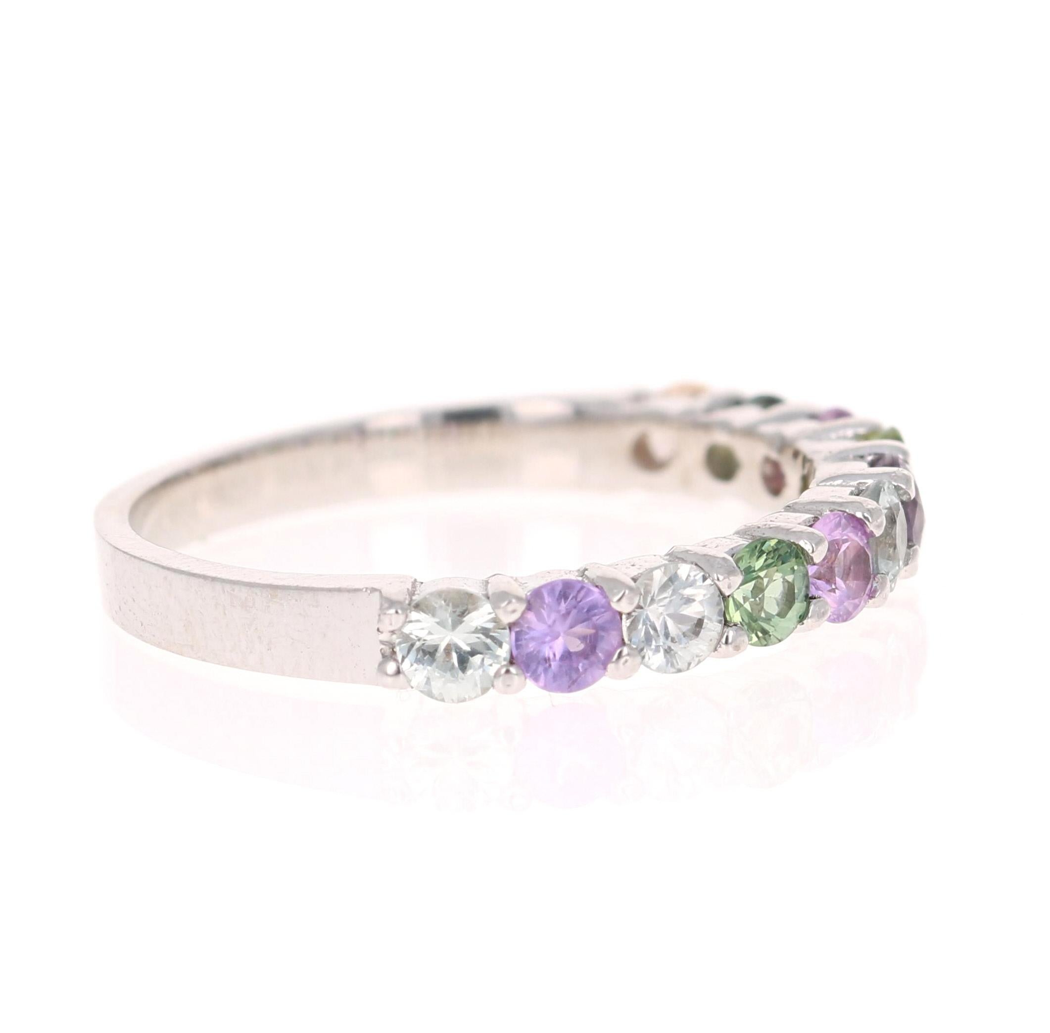 There are 9 Multicolored Natural Sapphires in this band that weigh 1.35 Carats. It is curated in 14 Karat White Gold with an approximate weight of 2.0 grams. 

It is perfect for everyday wear and looks amazing stacked or alone. They are versatile