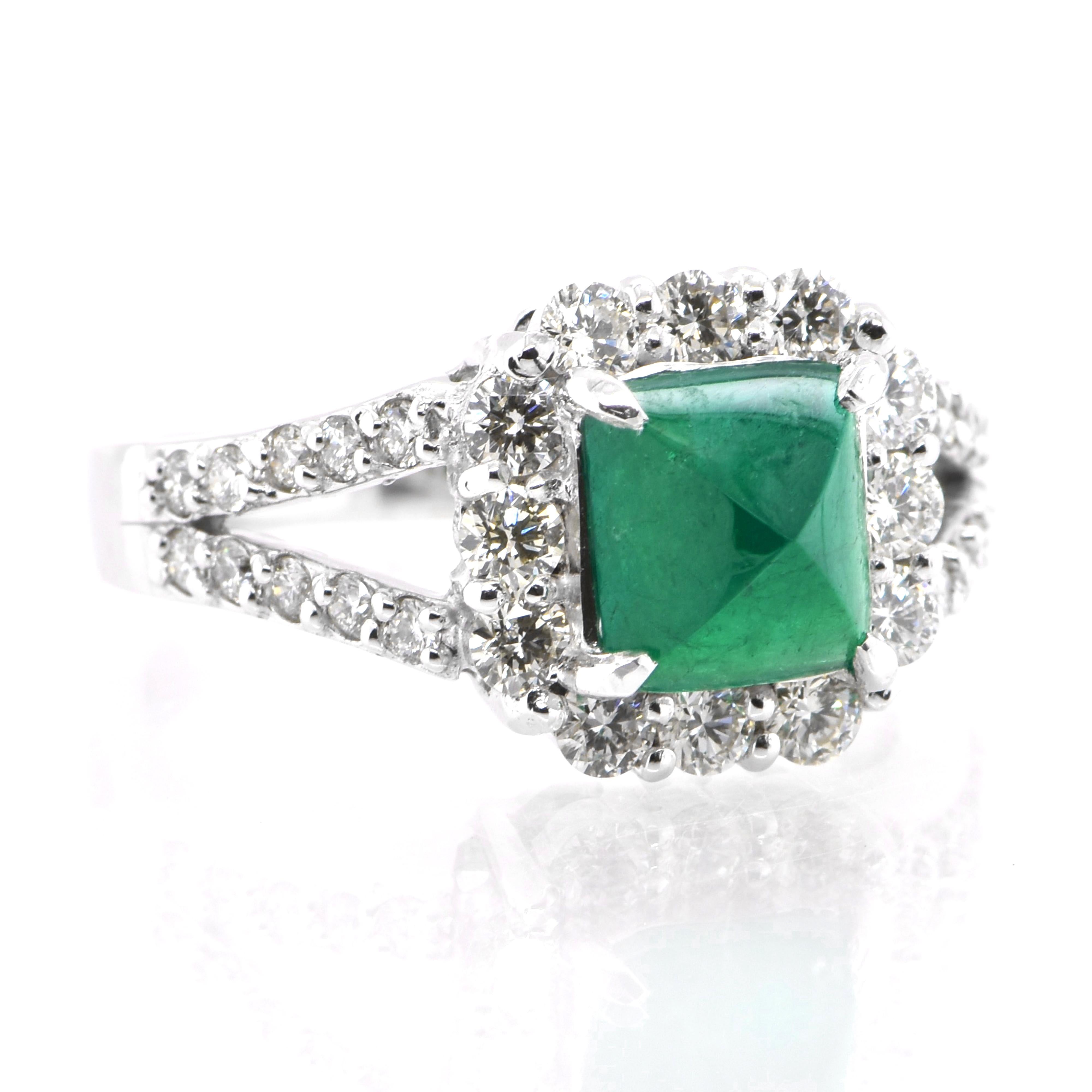 A stunning ring featuring a 1.35 Carat Natural Sugarloaf Emerald and 0.88 Carats of Diamond Accents set in Platinum. People have admired emerald’s green for thousands of years. Emeralds have always been associated with the lushest landscapes and the