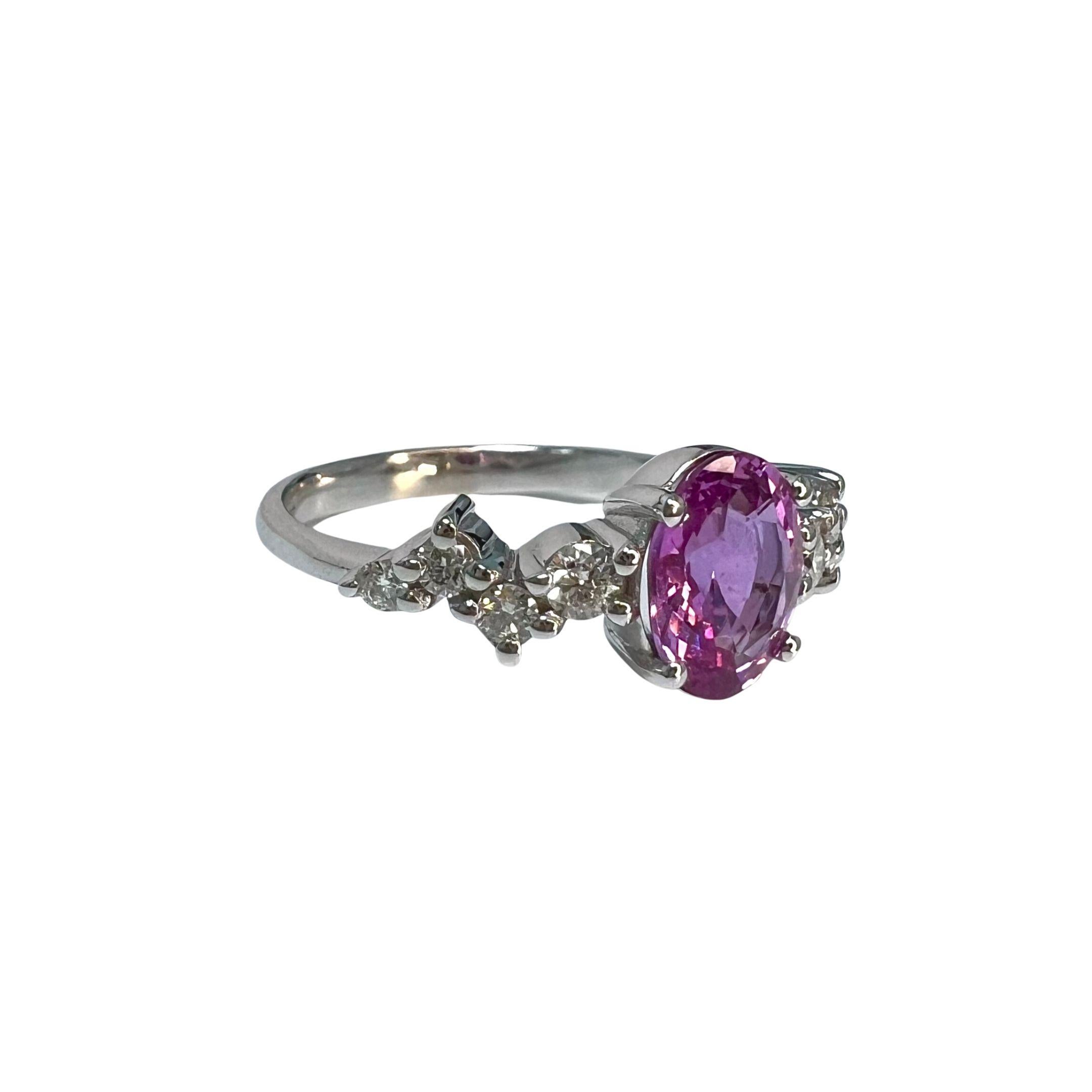 Sapphire Weight: 1.35 CTs
Measurements: 8x6 mm
Diamond Weight: 0.20 CTs
Metal: 18K White Gold 
Gold Weight: 3.41 gm
Ring Size: 6.5
Shape: Oval
Color: Intense Pink
Hardness: 9
Birthstone: September
Product ID: MUR25318/Line 14