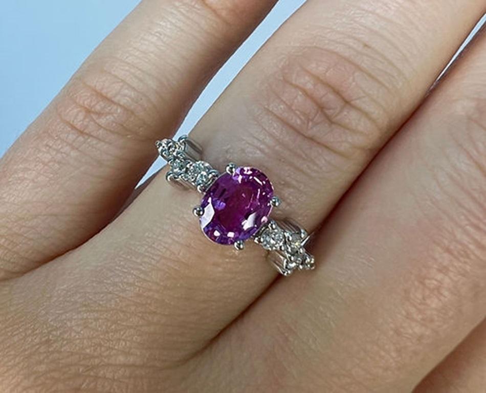 Sapphire Weight: 1.35 CTs, Measurements: 8x6 mm, Diamond Weight: 0.20 CTs, Metal: 18K White Gold, Gold Weight: 3.41 gm, Ring Size: 6.5, Shape: Oval, Color: Intense Pink, Hardness: 9, Birthstone: September