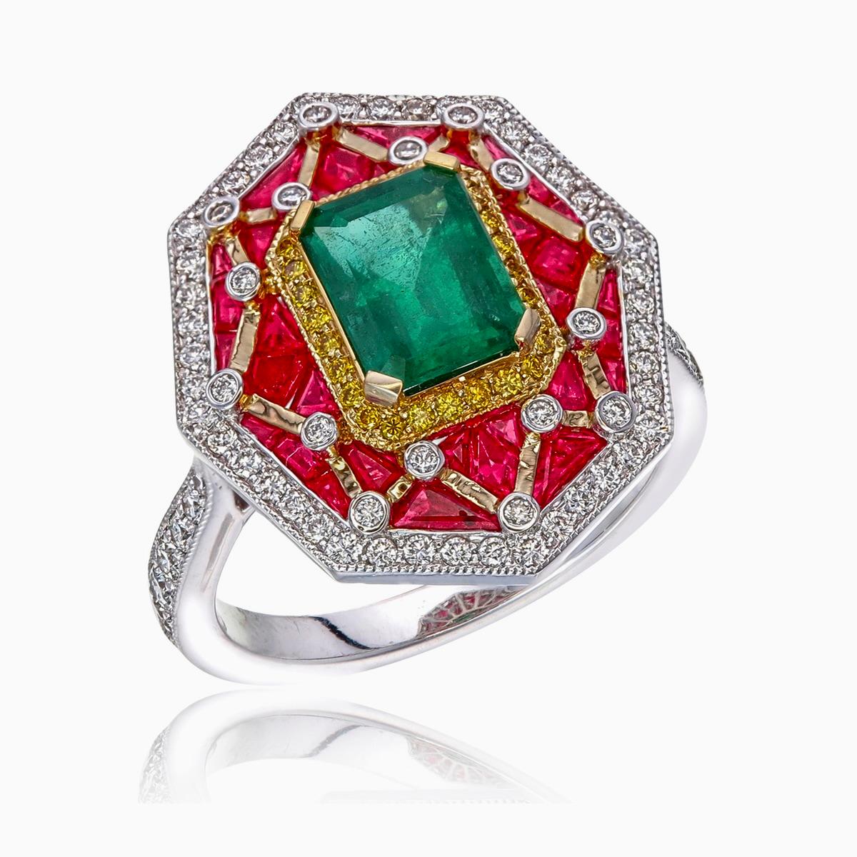 A brand new stunning ring with a fusion of vibrants colours and exceptional craftsmanship featured by Rewa Jewels made in 18 karat white gold.

- A captivating octagon shaped emerald  at its centre weighing approximately 1.35 carat rich in character
