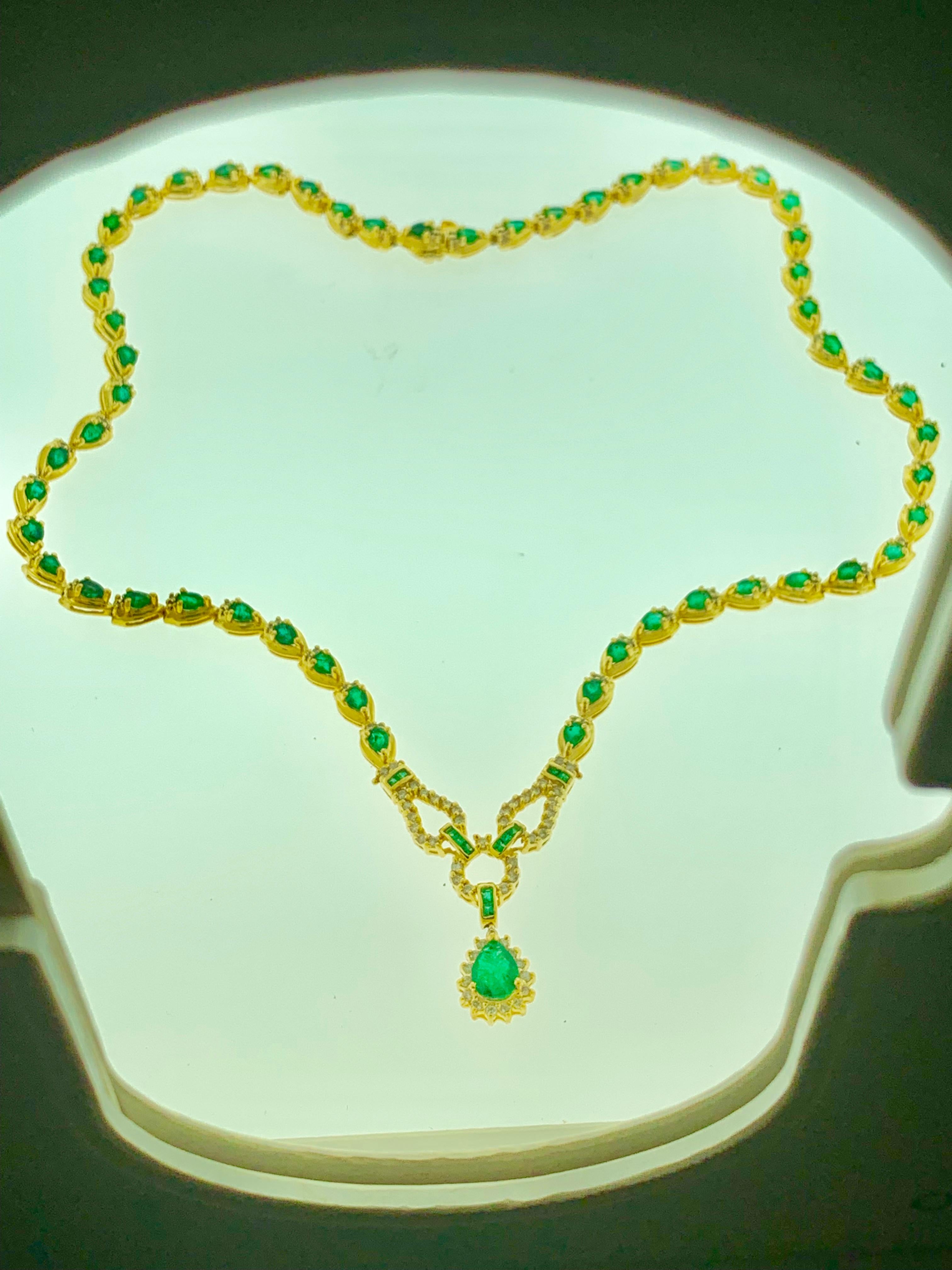 13.5 Carat Pear Shape Emerald & 1 Carat Diamond Necklace in 14 Karat Yellow Gold
This spectacular Bridal  Necklace  consisting of 55 Pear shape emeralds , each emerald approximately 25 Carat. One emerald drop in the center is big . it is 1 Ct +
Very
