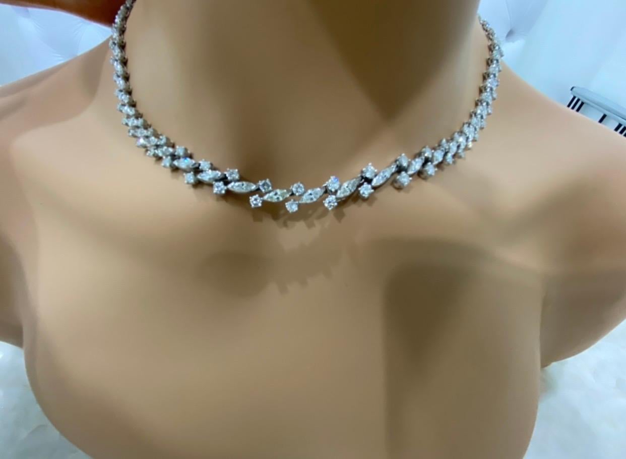 Quality, Fine Craftsmanship  & High Style!
This Platinum necklace features stunning marquise and round-cut diamonds in an exquisite alternating pattern with a fabulous diamond clasp. Bow shaped Clasp is adorned with baguette shaped diamonds. 
51