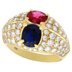 Anello in oro giallo con rubino da 1,35 carati e zaffiro da 1,28 carati e diamante da 1,75 carati