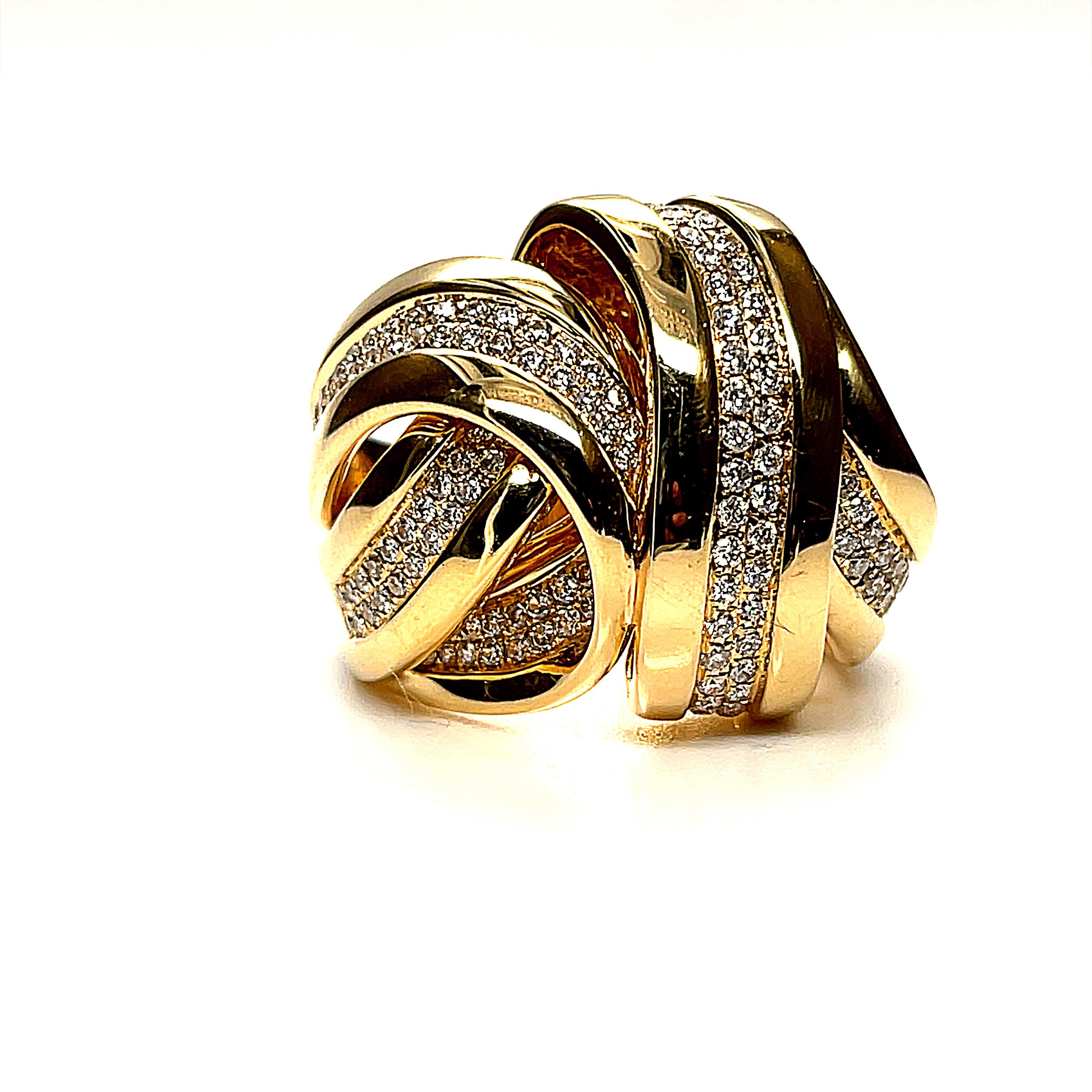 This handsome 18k yellow gold dome ring features a total of 1.35 carats of round brilliant diamonds, pave set in flowing 