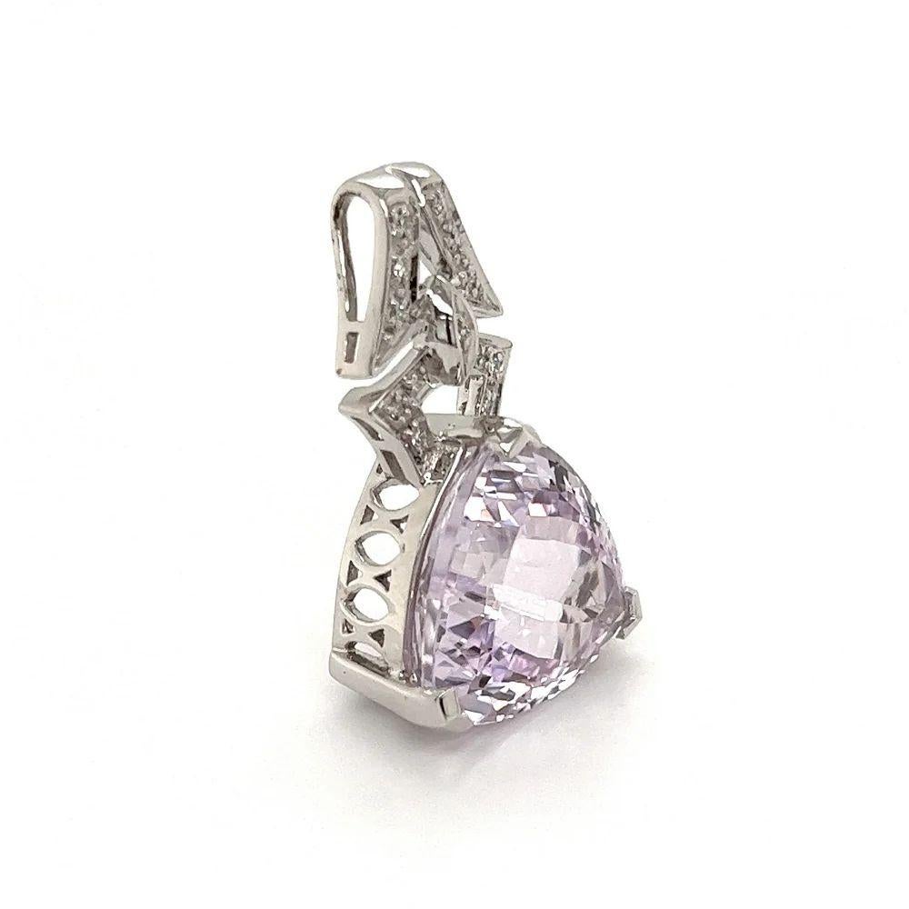 Simply Beautiful! Trillion Kunzite and Diamond Gold Pendant Necklace. Featuring a Trillion faceted Kunzite, weighing approx. 13.5 Carats. Accented by Diamonds, weighing approx. 0.19tcw. Hand crafted 18k White Gold mounting. Suspended on an 18k White