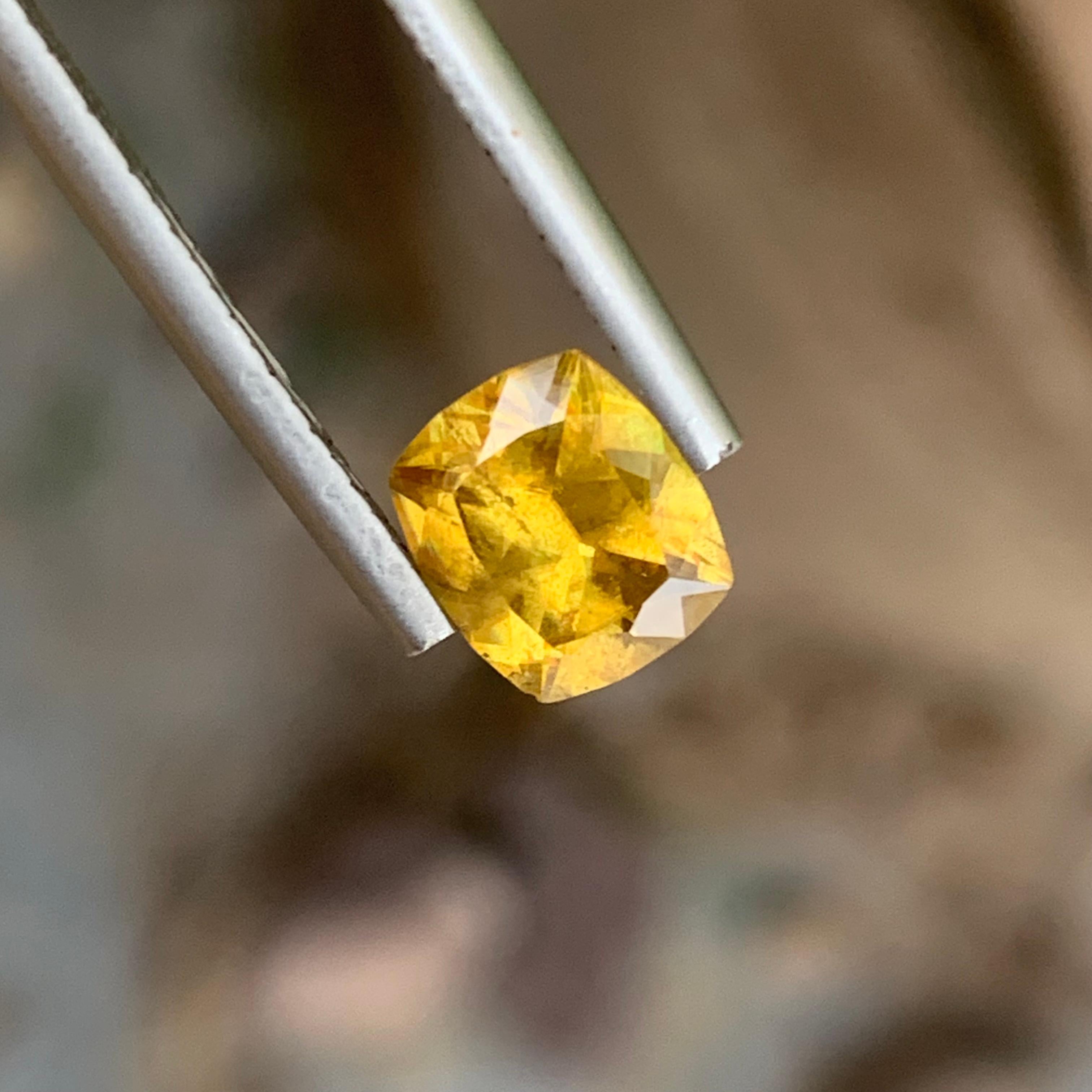 Faceted Sphene
Weight: 1.35 Carats 
Dimension: 7.3x6.4x3.8 Mm
Origin: Warsak Pakistan 
Shape: Cushion
Color: Yellow
Treatment: Non
Certificate: On Demand
Yellow sphene, also known as titanite, is a captivating and rare gemstone celebrated for its