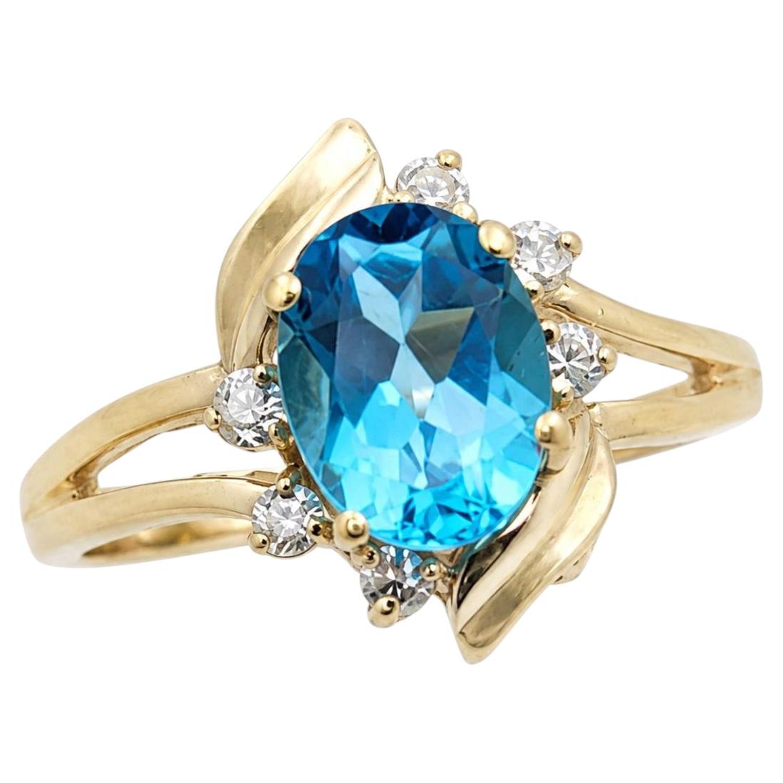 Anello floreale in oro giallo 14 carati con topazio blu da 1,35 carati e diamanti