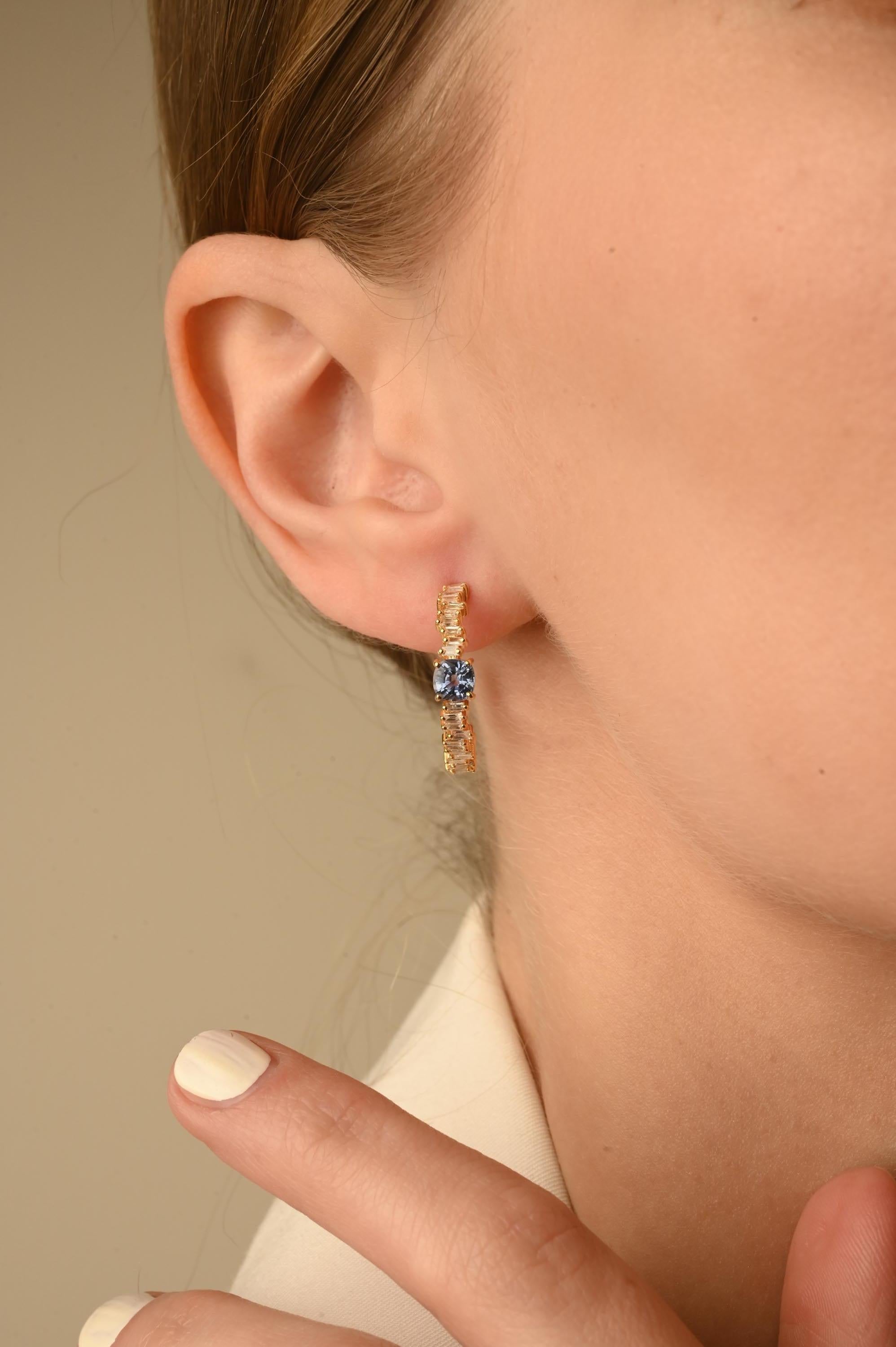 Blue Sapphire Hoop Earrings in 14K Gold with Diamonds to make a statement with your look. You shall need open hoop earrings to make a statement with your look. These earrings create a sparkling, luxurious look featuring cushion cut
