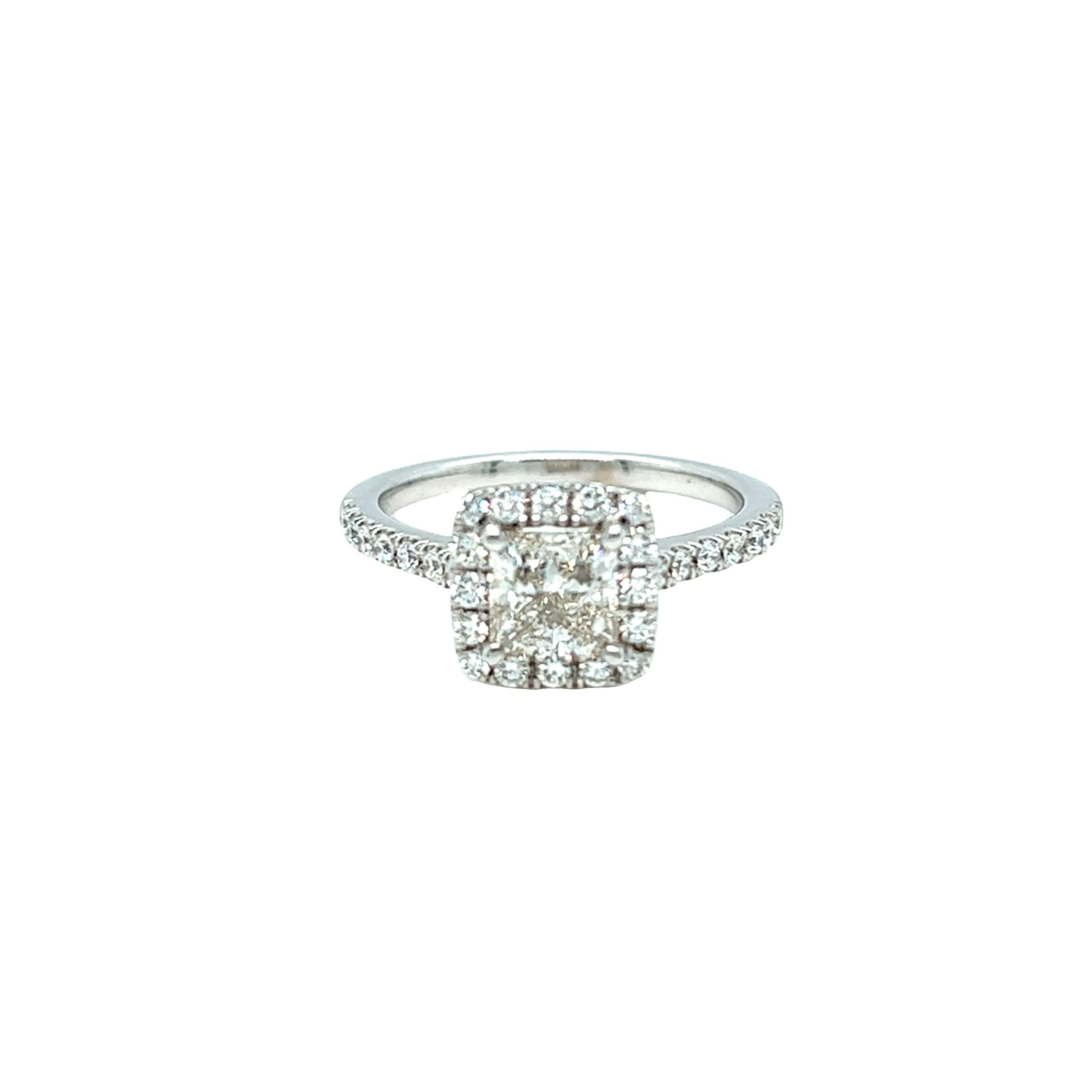 Modern classic diamond engagement ring showcases a princess cut diamond weighing approximately 0.90 carat, H-I color, and VS clarity. Small near colorless diamonds dress up the center stone and continues the glitter down the band. The total weight