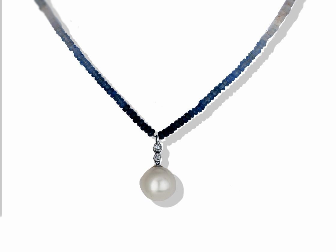 13.5 mm sapphire hombre necklace measuring 36 inches and .10 carats of diamonds in white gold. This strand measures 36 inches and has even gradient hombre pattern from dark blue sapphire to white sapphire. Each stone is a rough cut and gives the