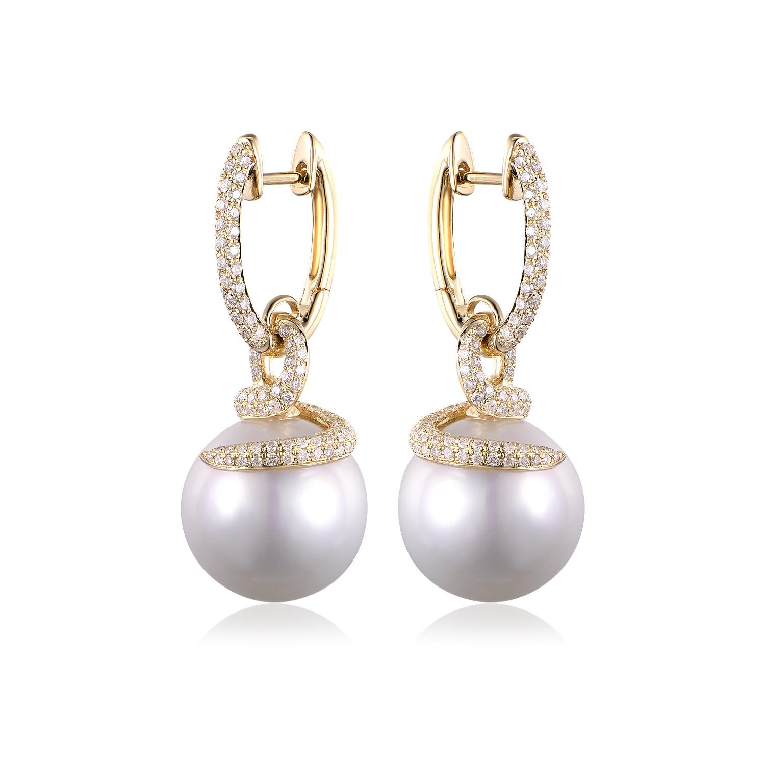 These stunning earrings feature exceptionally large South Sea pearls, their impressive size of 13.5 x 16mm showcasing the pearls' luxurious sheen and near-perfect form. Cradled in the embrace of 14K yellow gold, these magnificent pearls radiate with