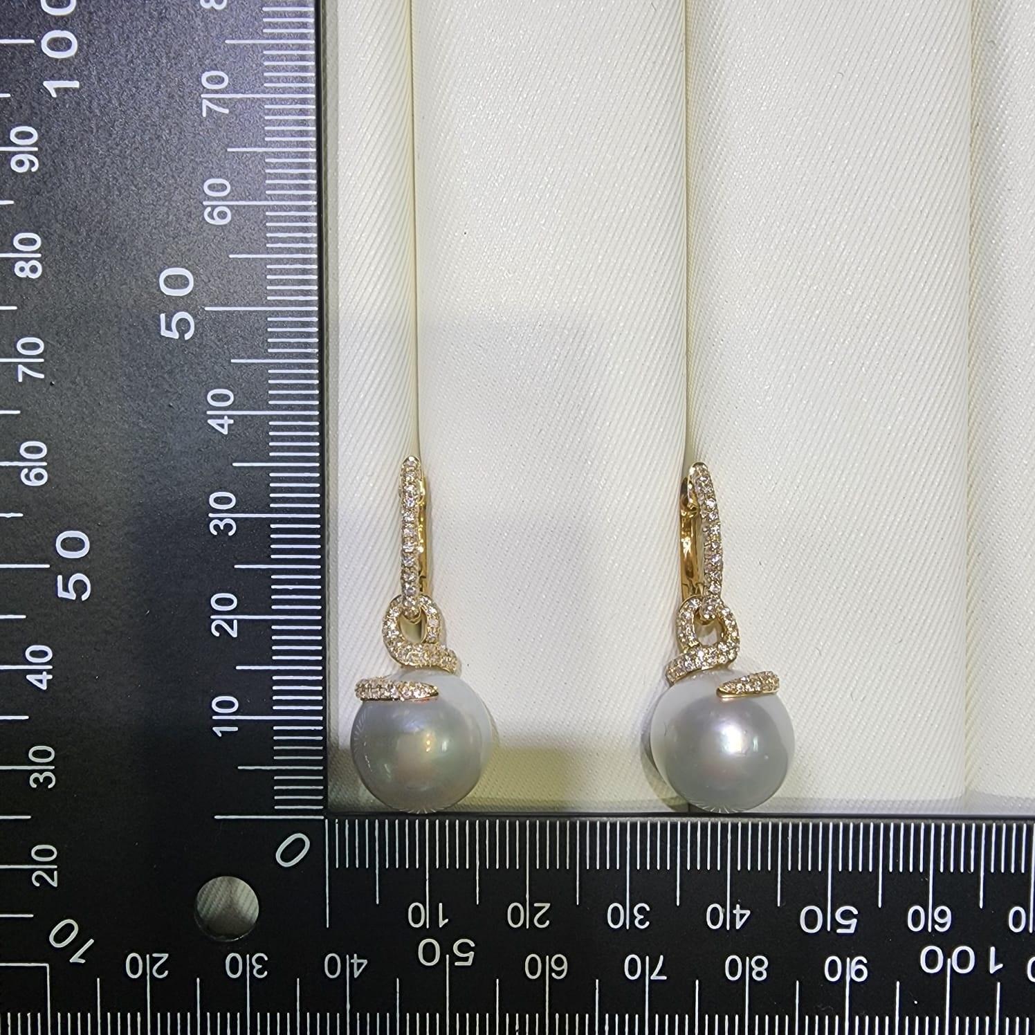 Contemporary 13.5 x 16mm Oval South Sea Pearl Diamond Dangle Earrings in 14 Karat Yellow Gold For Sale