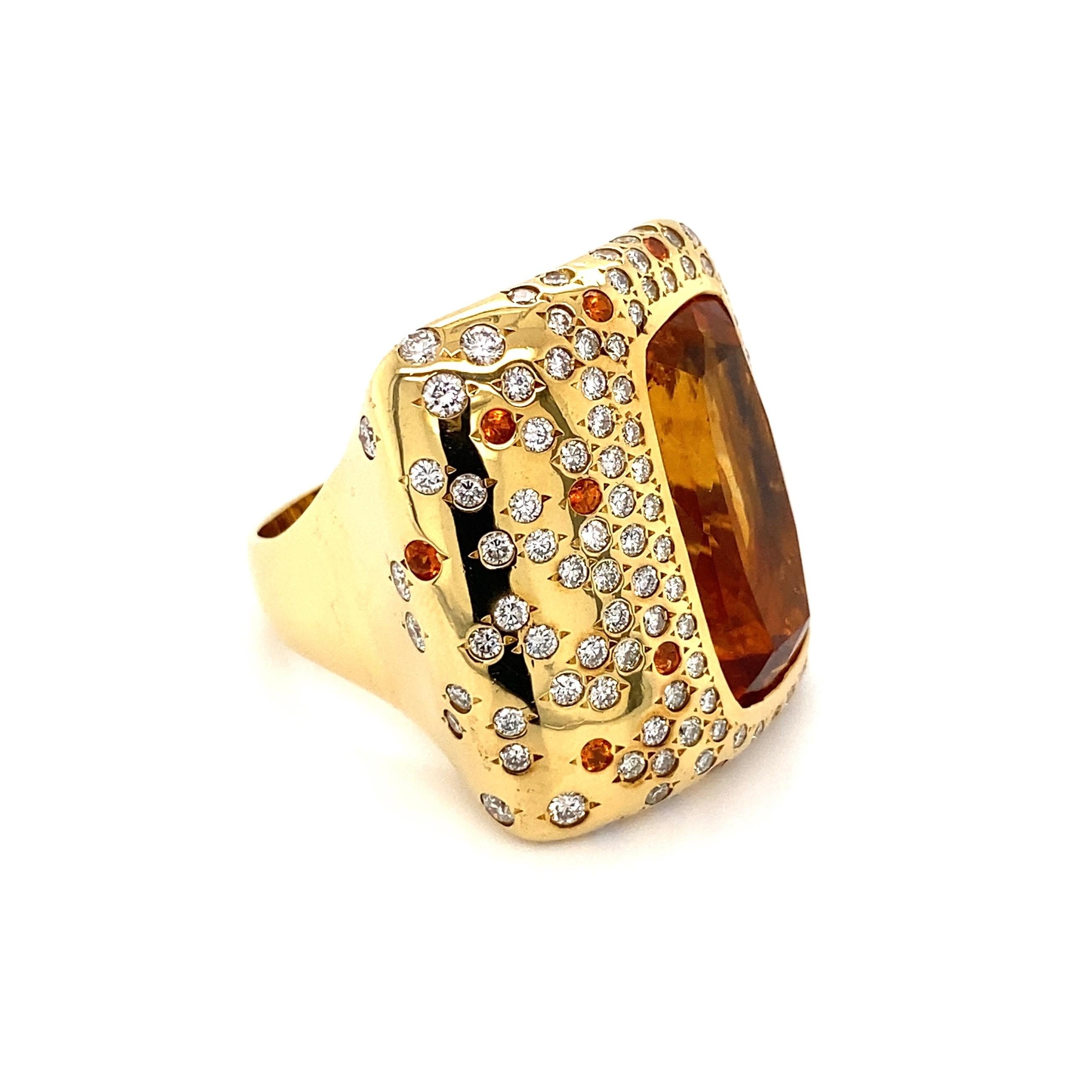 
Simply Fabulous, Timeless and finely detailed Citrine, and Diamond and Spessartite Garnet Gold Cocktail Ring, center securely nestled with a 13.50 Carat Citrine, surrounded and accented by Diamonds weighing approx. 2.70tcw and Spessartite Garnet