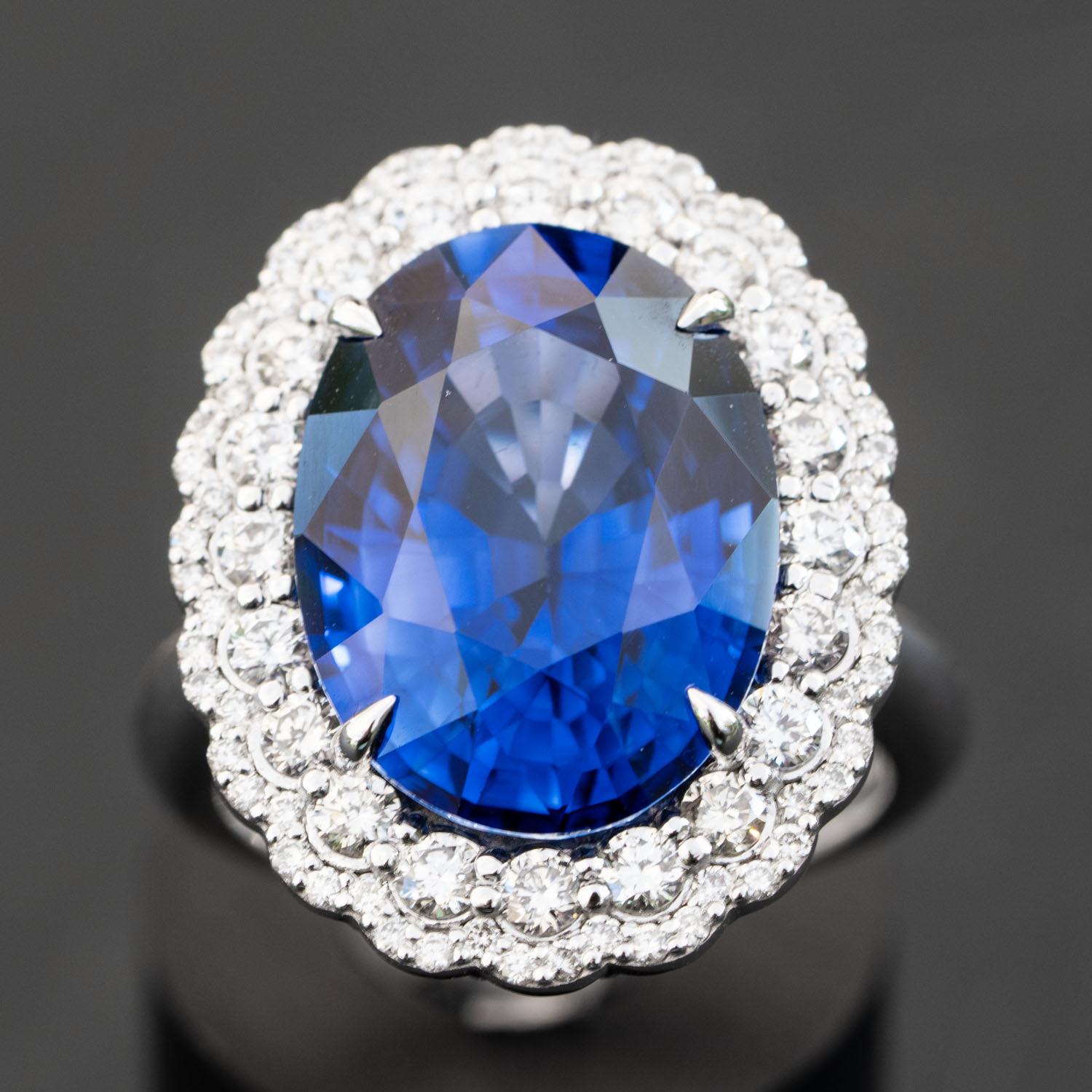 This gorgeous blue sapphire ring will impress everyone around you. It features a large oval 13.50 carat gemstone, adorned with 1.01 carat natural diamonds.

Diffused Sapphire
Oval Sapphire                                                             