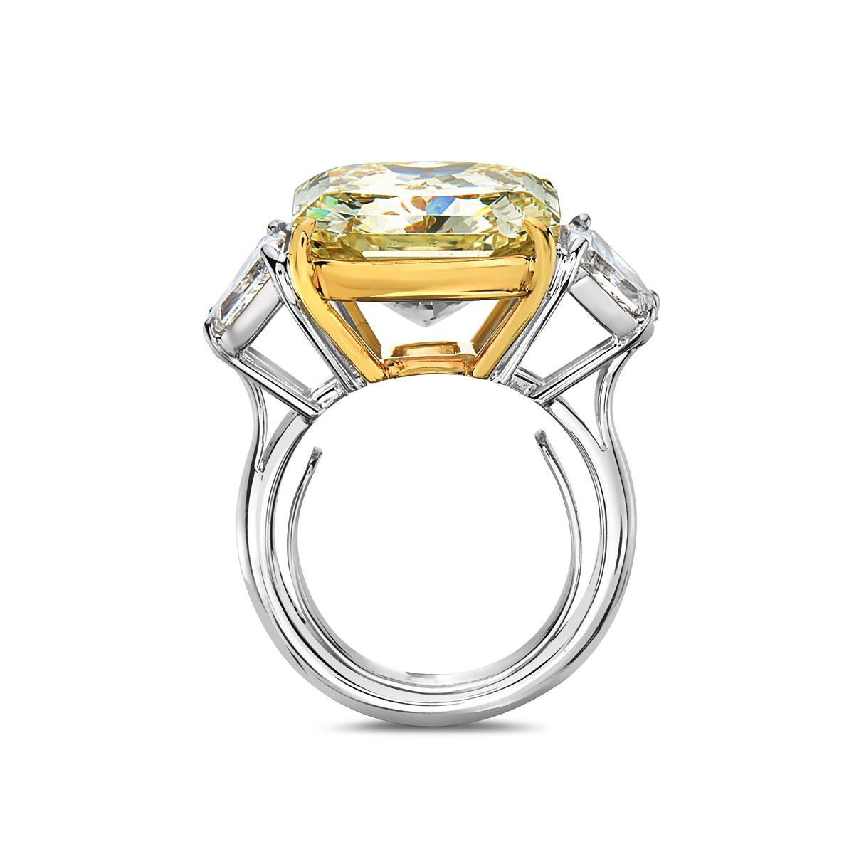 This engagement ring features a 13.53 carat square radiant VVS1 mounted in 18K white and yellow gold flanked by two F-G VVS trapezoid diamonds. 13.1 grams total weight. Made in Italy. Size 5.5. GIA report No. 2181942775.   

Resizeable upon request.