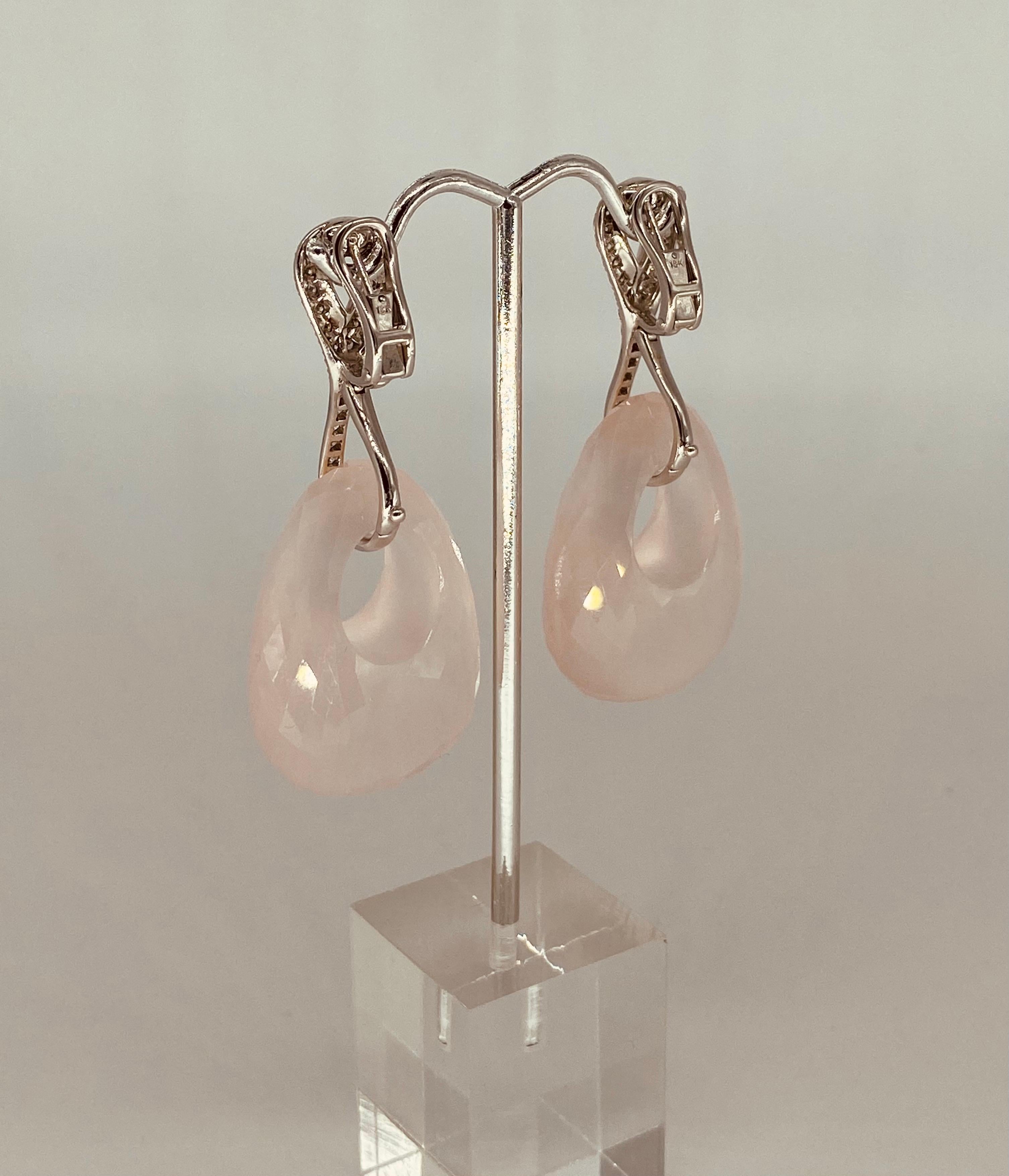 135.5 Carat Oval Rose Quartz With White Diamonds Clip On Duo Dangling Earrings.
Beautifully assembled with master work experience. These earrings a fashion statement! The earrings feature an optional in-ear stems or simply clip earrings. Featuring