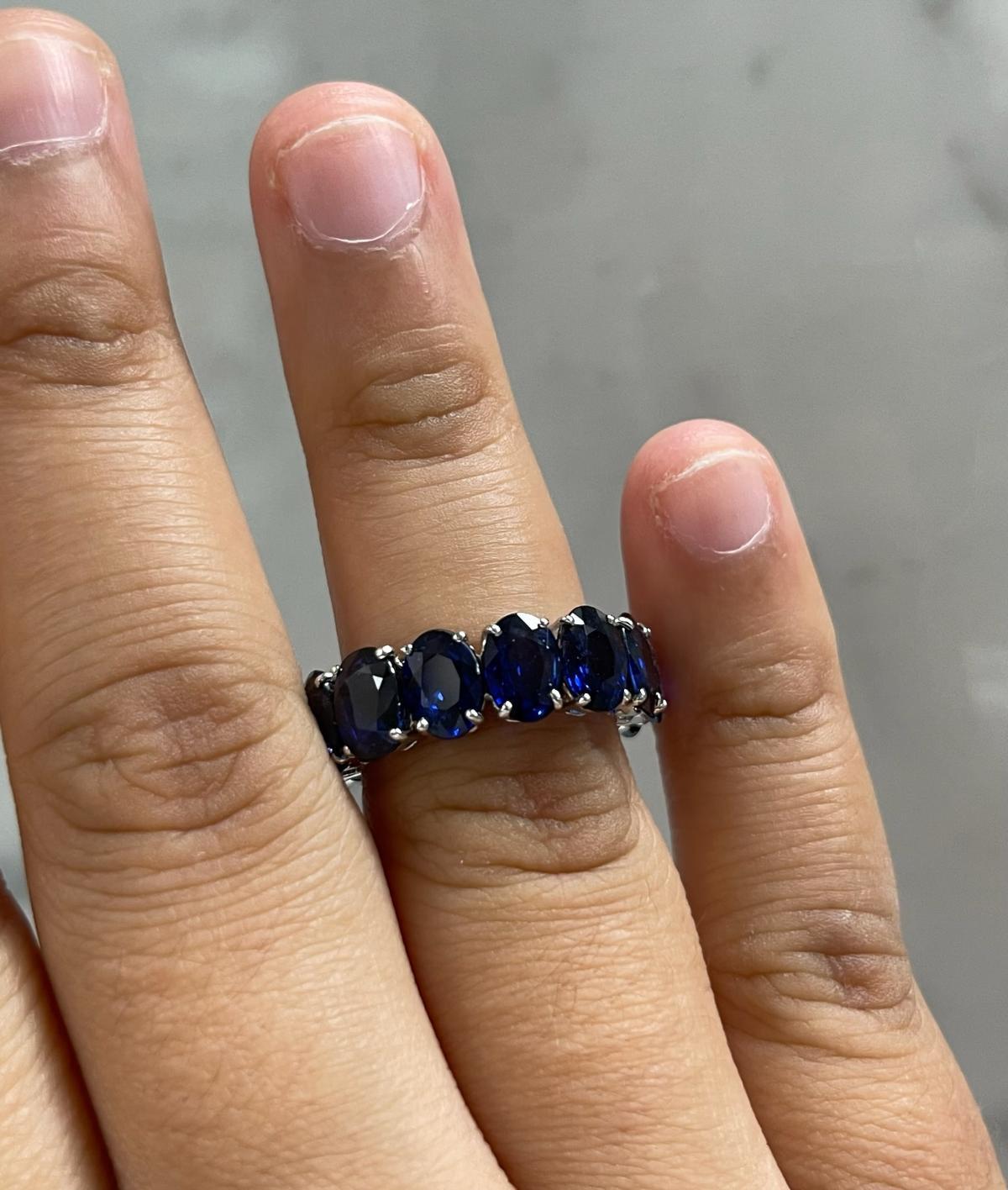 This one is truly one of a kind ring that will have people turning heads .... 

The ring holds fourteen (14) royal blue oval sapphires weighing 13.59CTW set in a 14K White Gold Four Prong Eternity Band (Size 6.5)

