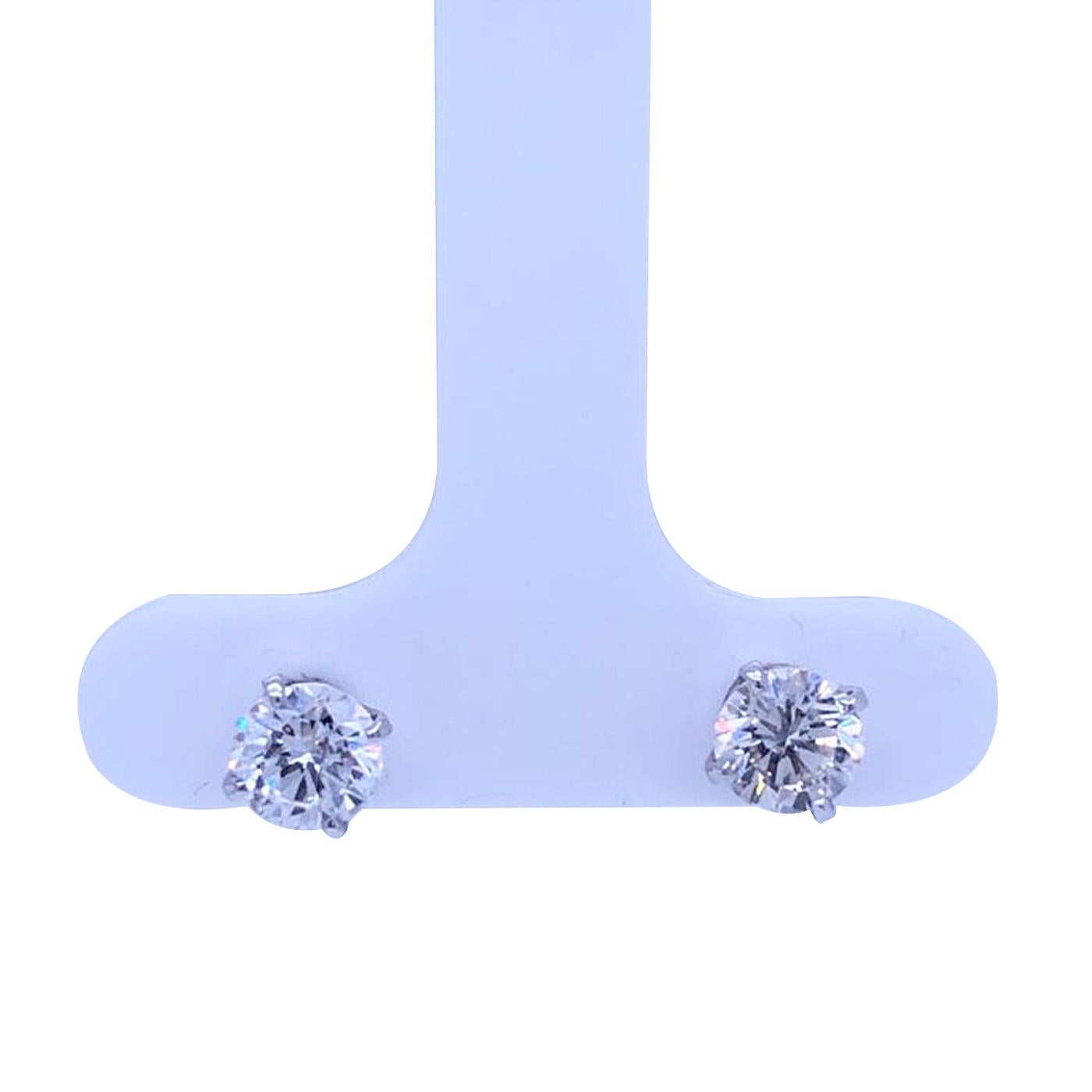 These four-prong basket diamond earrings are designed in 14kt white gold. Gorgeously featured in these exquisite earrings are 2 very good cuts H-I SI2-SI3 round diamonds.
Sturdy diamonds set in prong setting form these fancy diamond stud