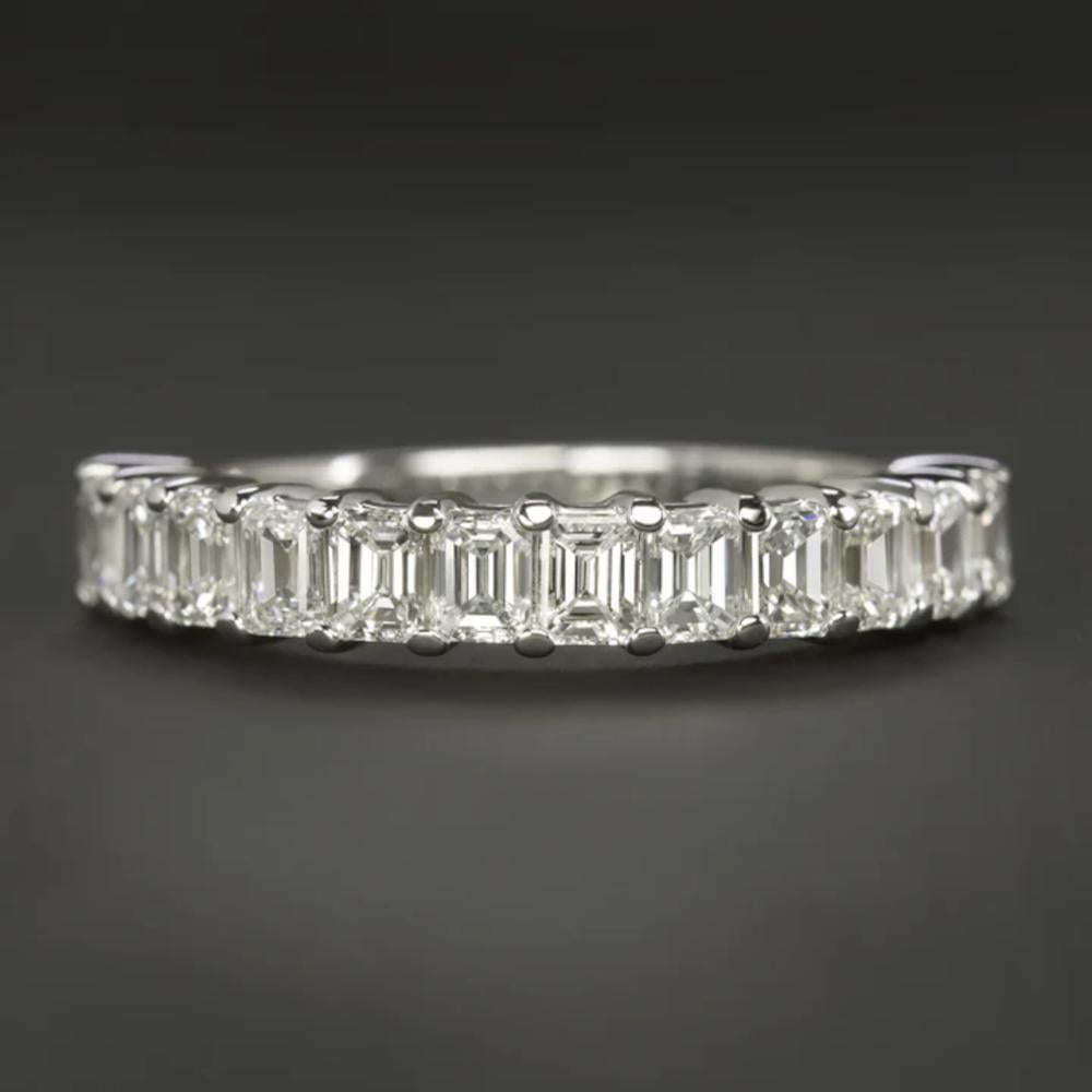 This diamond band features a timeless design adorned with 1.35 carats of high-quality emerald cut diamonds, making it an ideal choice as a wedding band or a stunning stand-alone piece. 
The diamonds are bright white and exceptionally clean, with