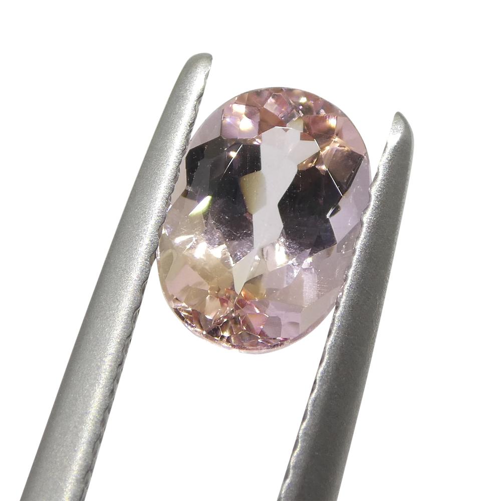 1.35ct Oval Orangy Pink Imperial Topaz GIA Certified 10