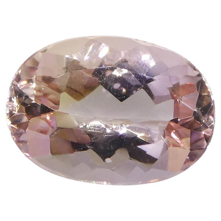 1.35 Carat Oval Orangy Pink Topaz GIA Certified For Sale