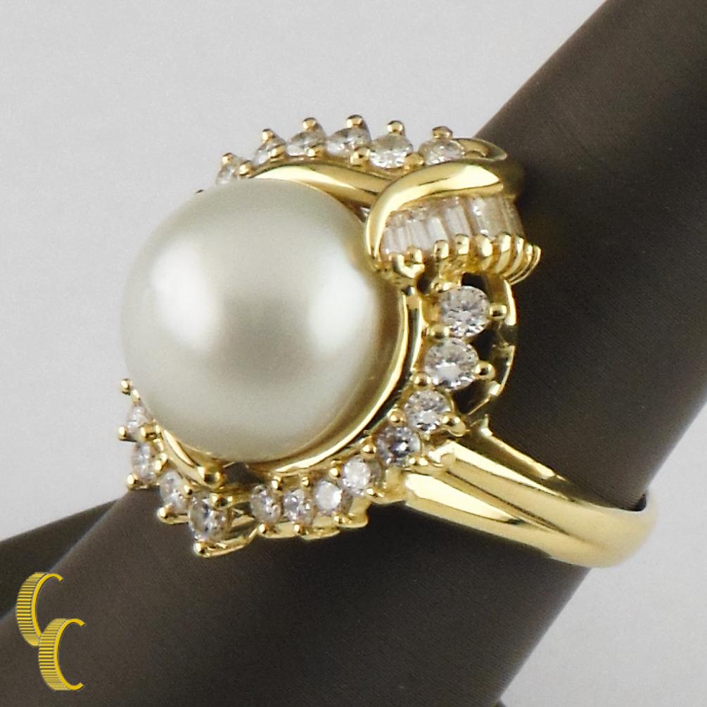 Gorgeous South Sea Solitaire Pearl Ring w/ Diamond Accent
Features Diamond Bezel w/ Round Brilliant Diamonds and Baguette Diamonds
18K Yellow gold Setting
Total Mass - 15.1 g
Carat total weight - 1.40 Ct
Color - G
Clarity - VS
South Sea Pearl