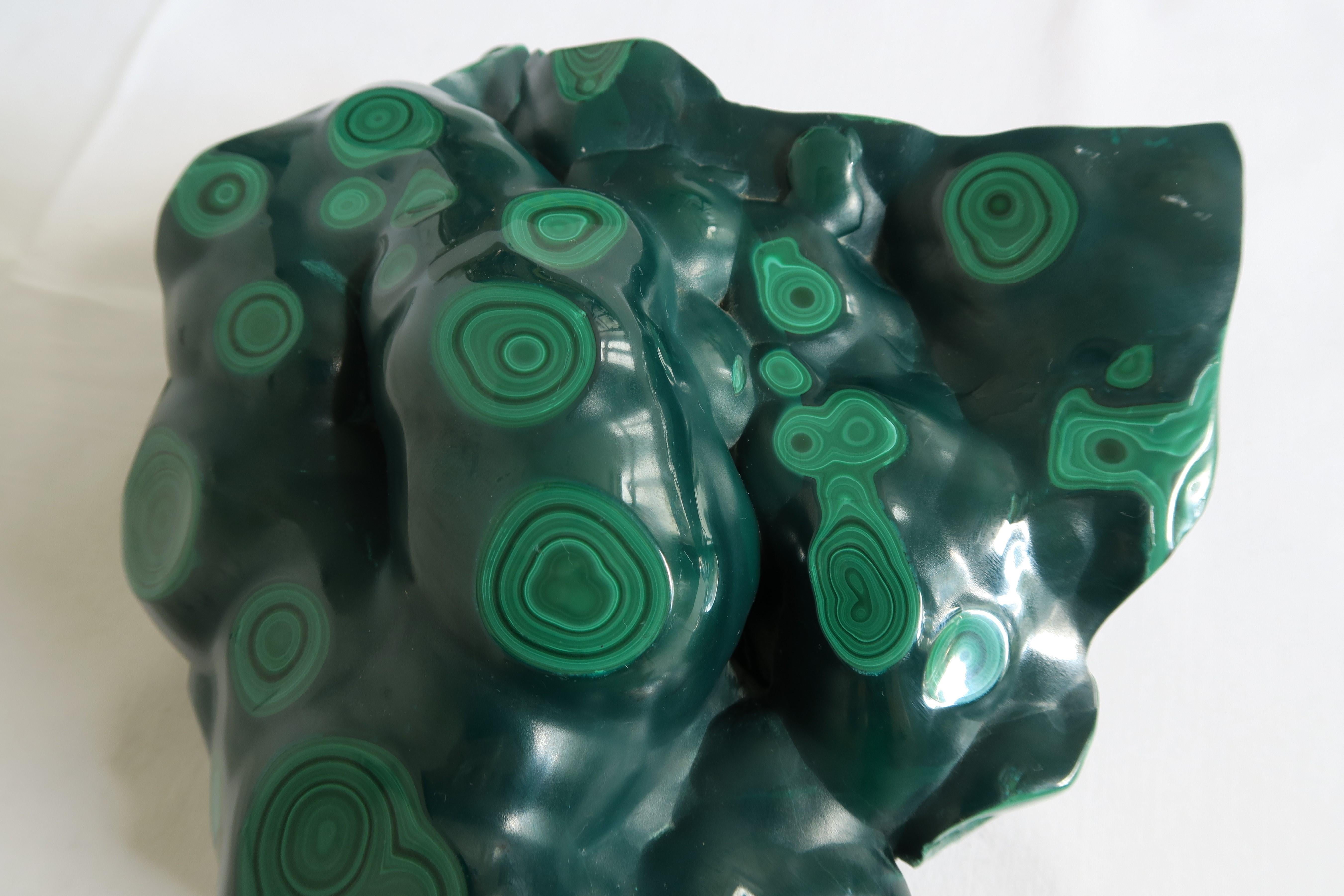 For sale is an original malachite. It weighs 3.83kg or 135oz and has been partially cut and polished to reveal its breathtaking structure and various shades of green. The bottom of the stone was kept its natural raw finish. Matchbox for