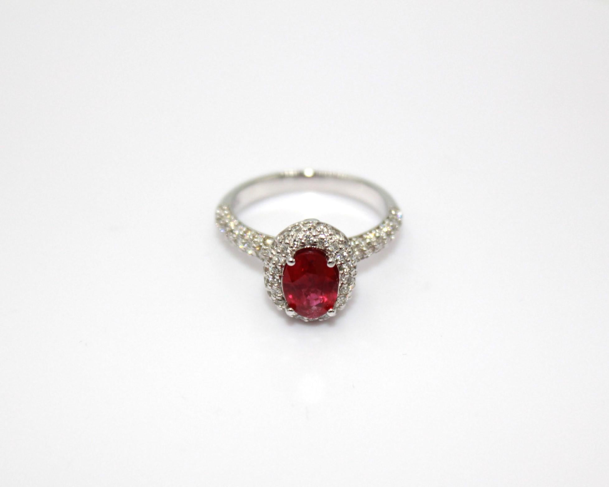 1.36 carats oval Burma Ruby, framed with 83 round diamonds, totaling a diamond weight of 0.61 carat. 

This stunning Ruby Diamond Ring will highlight your elegance and uniqueness. 

Item Details:
- Type: Ring
- Metal: 18K Gold
- Weight: 4.70