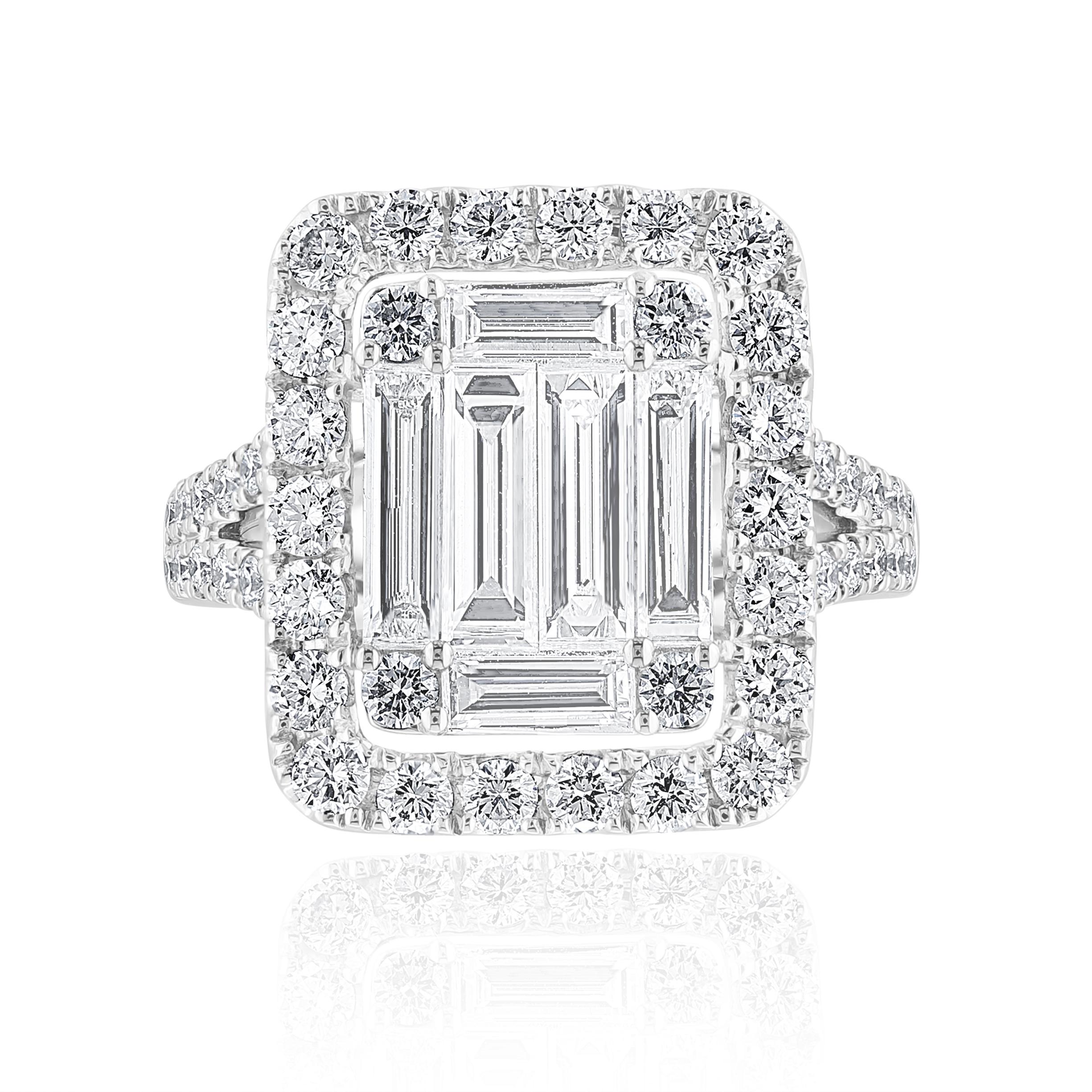 A brilliant and unique piece featuring a cluster of baguette diamonds shaped like an emerald cut, surrounded by a single row of round brilliant diamonds with a split shank. 6 Baguette diamonds weigh 1.36 carats total; round diamonds weigh 1.29
