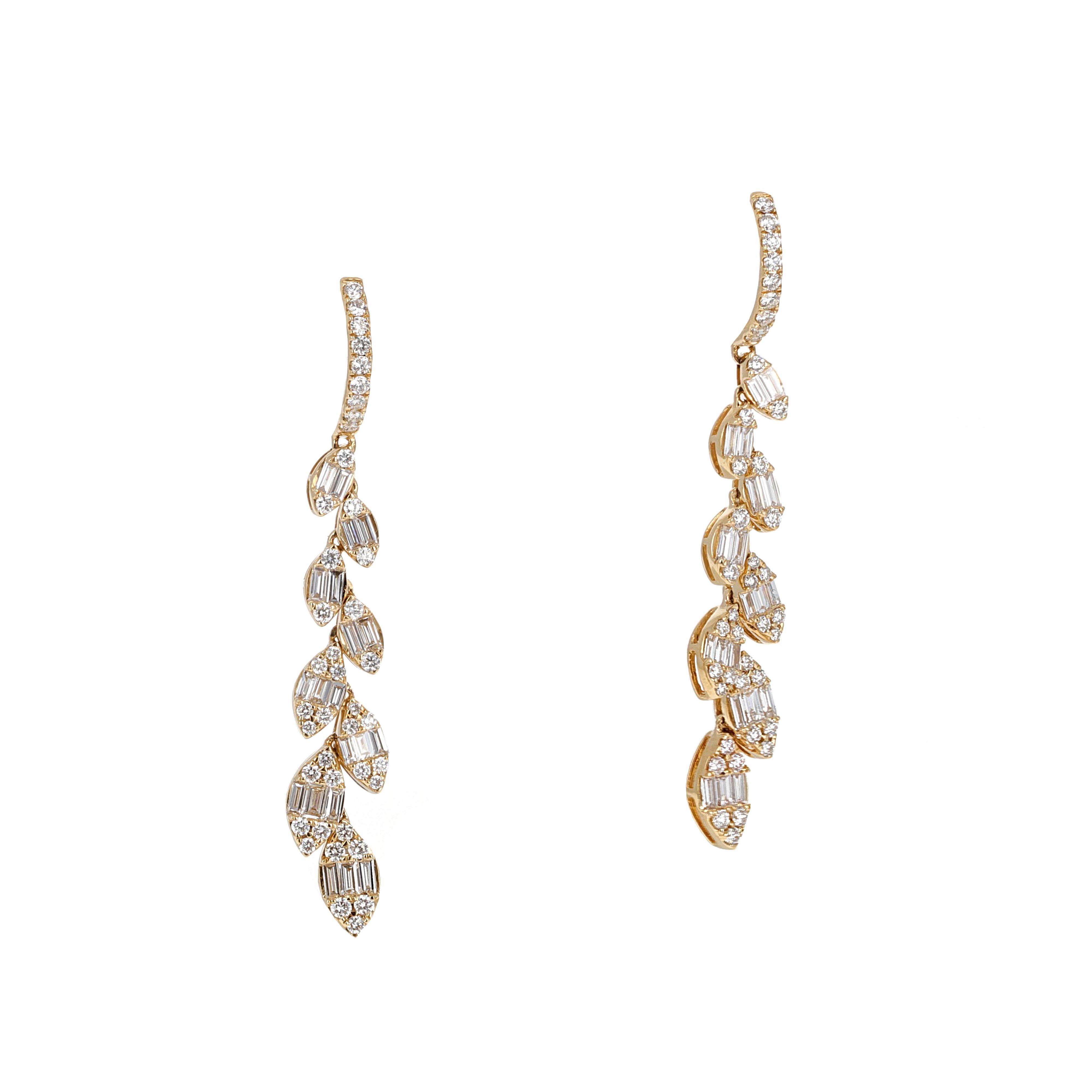 18 karat yellow gold diamond illusion dangle earrings. The stones in the earrings are made to look like marquise shaped diamonds. When you look at each marguise close up you will notice they are made up on round and baguette shaped diamonds. This is