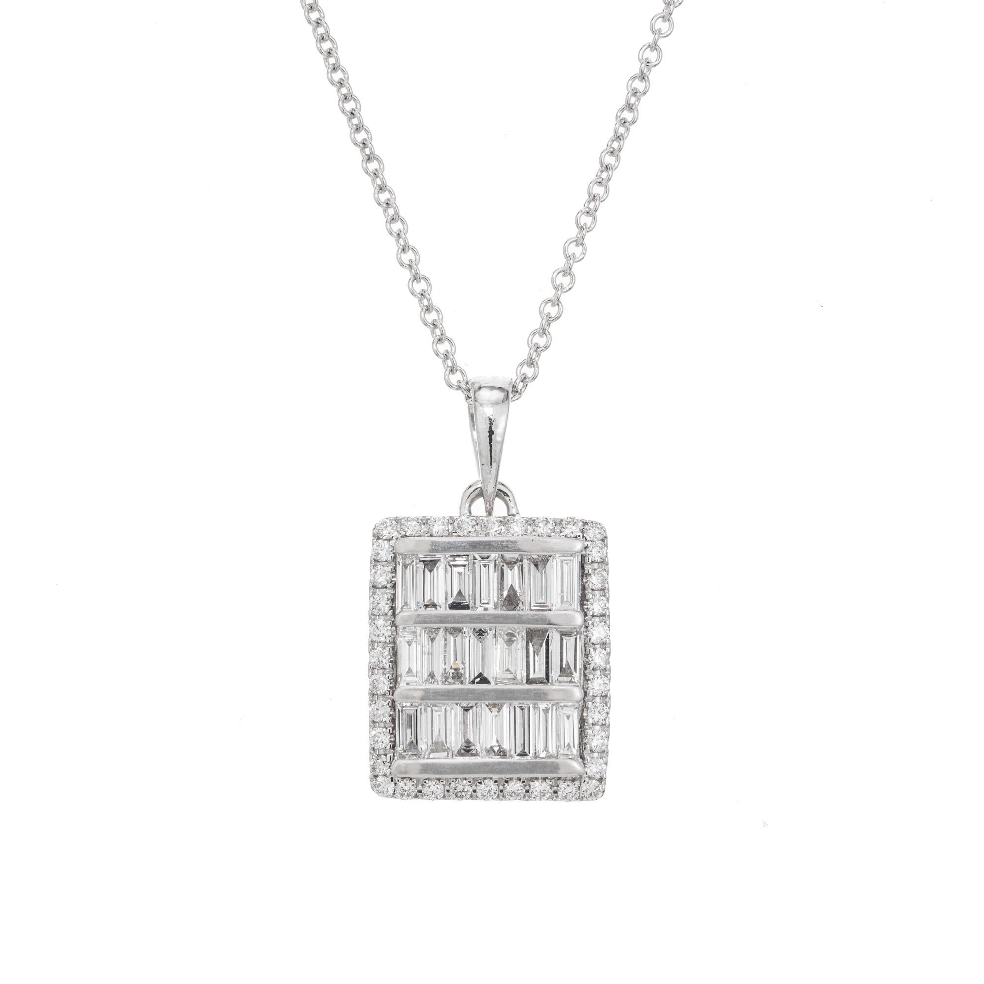 Diamond pendant necklace. This rectangle shaped setting has three rows for 21 straight baguette diamonds with a halo of 21 round brilliant cut diamonds which hangs from a 18 inch 14k white gold chain. 

21 straight cut baguette diamonds, G-H SI