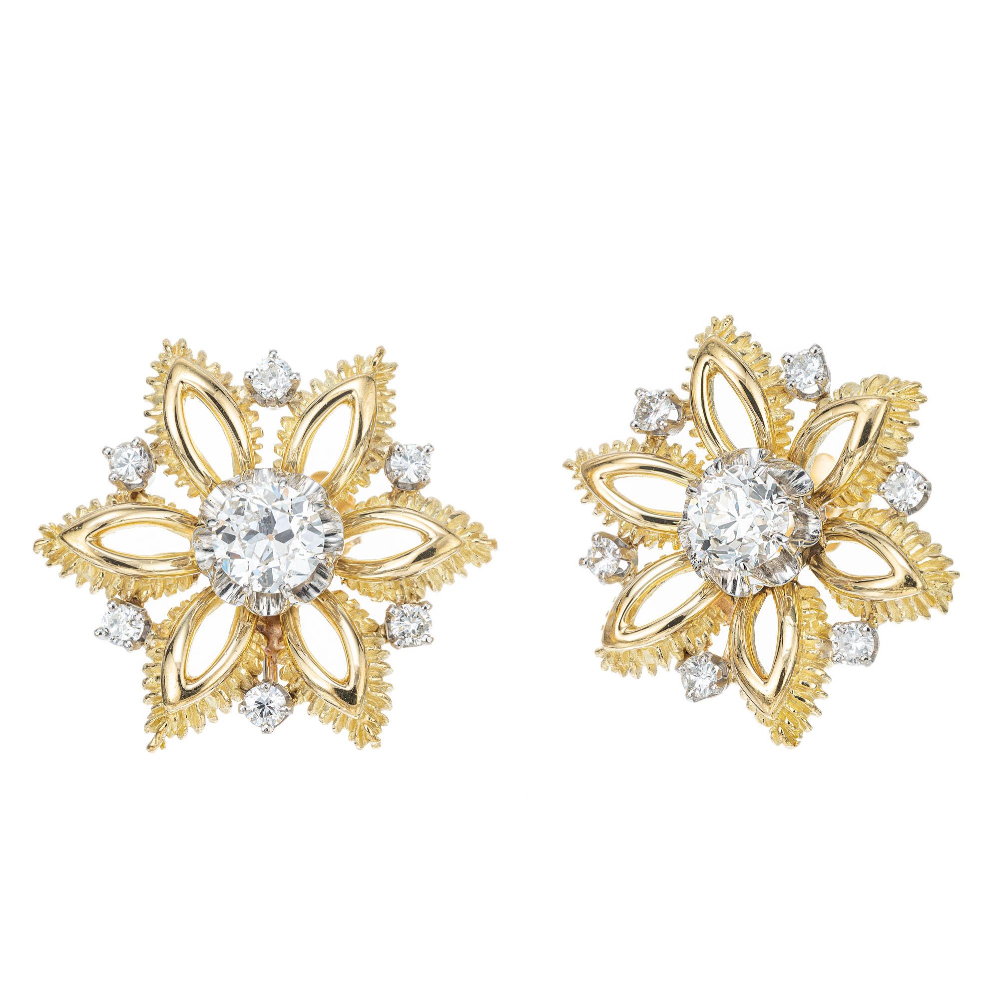 1970's diamond snowflake design earrings. 2 old European cut diamonds set in 18k yellow gold with 12 round brilliant cut diamonds set in 18k white gold. 

2 Old European cut diamonds, I SI approx. 1.00ct
12 round brilliant cut diamonds, G-H VS