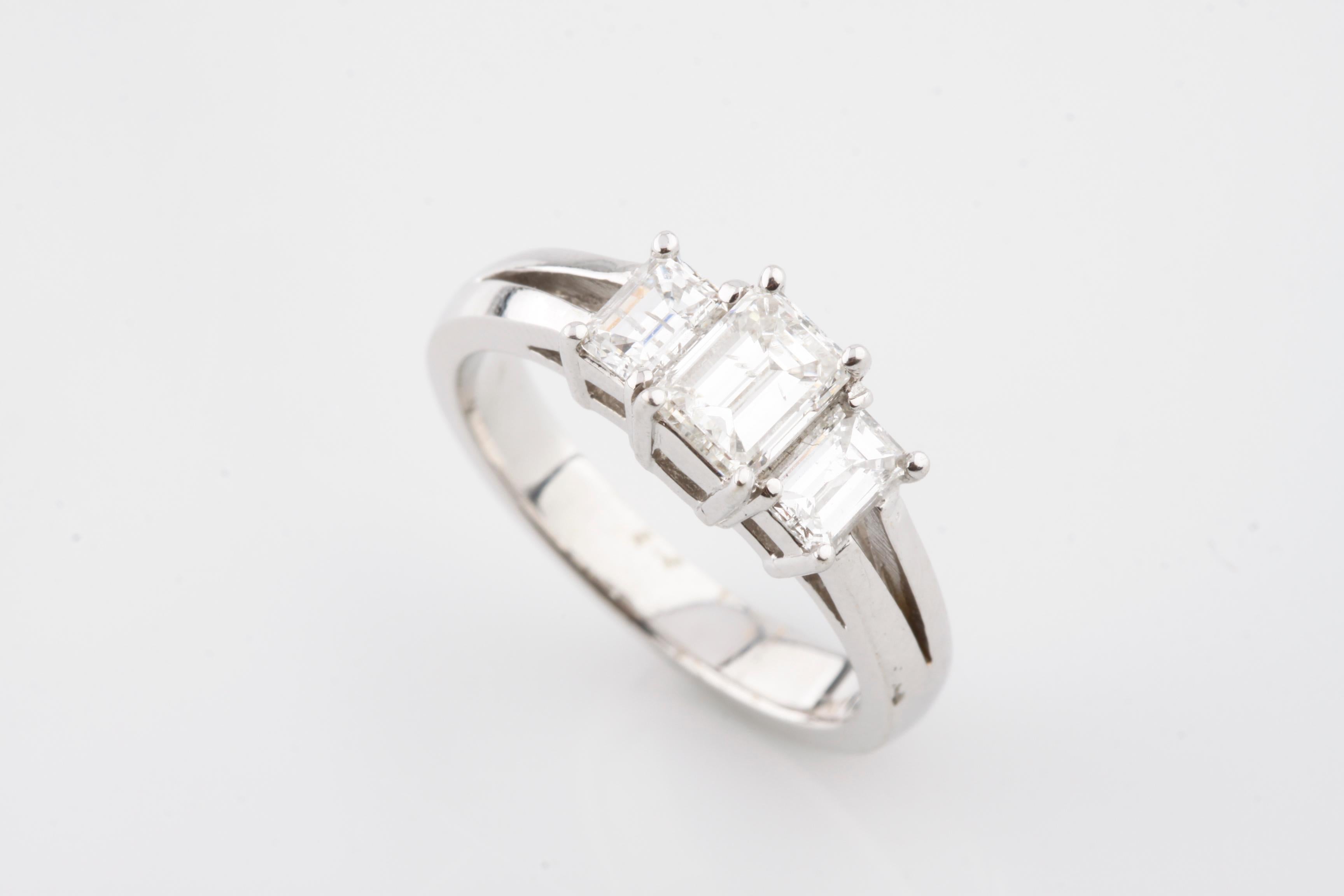 One electronically tested 18KT white gold ladies cast & assembled three diamond ring with a bright finish.
Condition is new, good workmanship.
Identified with markings of 