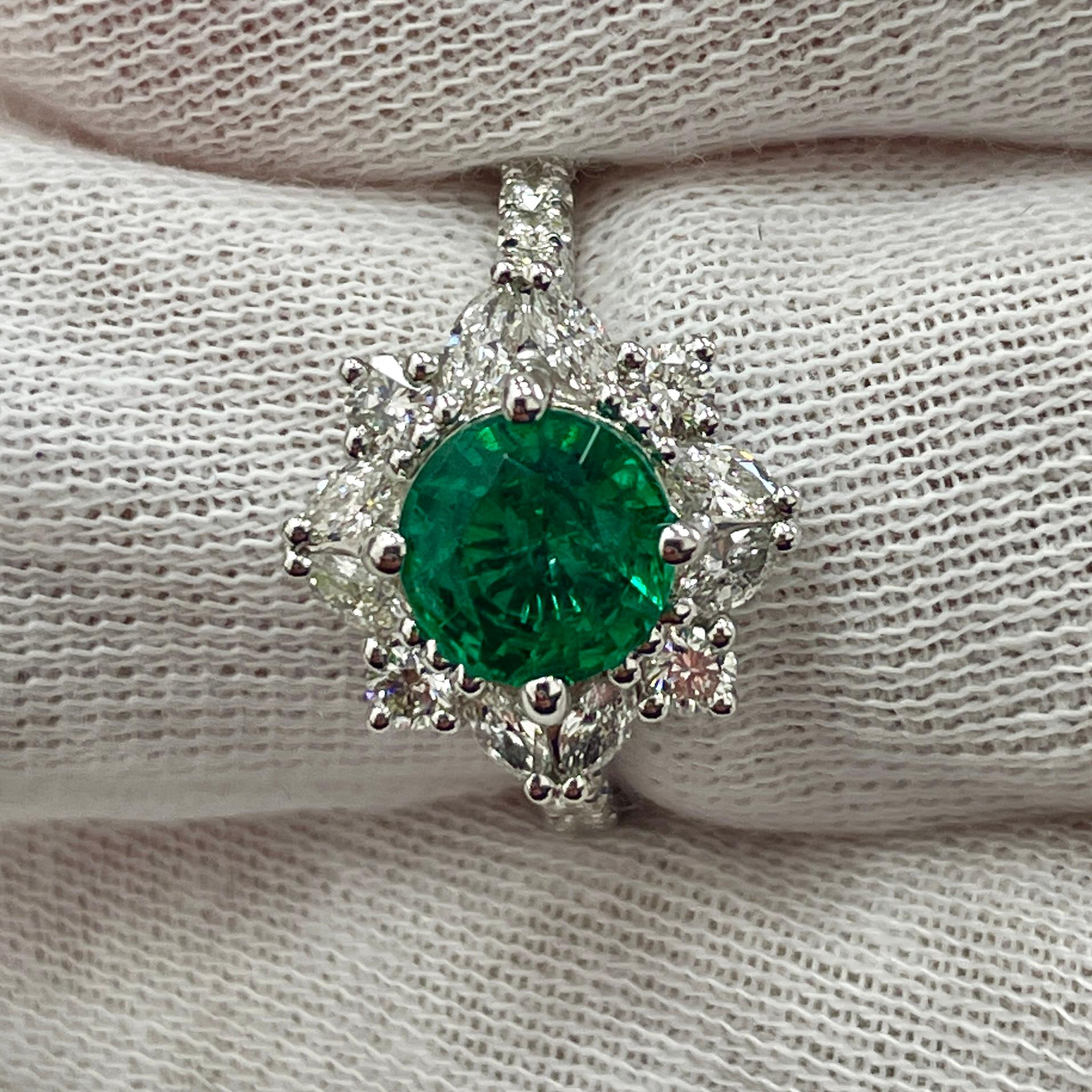 This is a STUNNING emerald with a very lively color, mounted in an elegant 18K white gold and diamond ring with 0.75Ct of brilliant white diamonds. Suitable for any occasion!