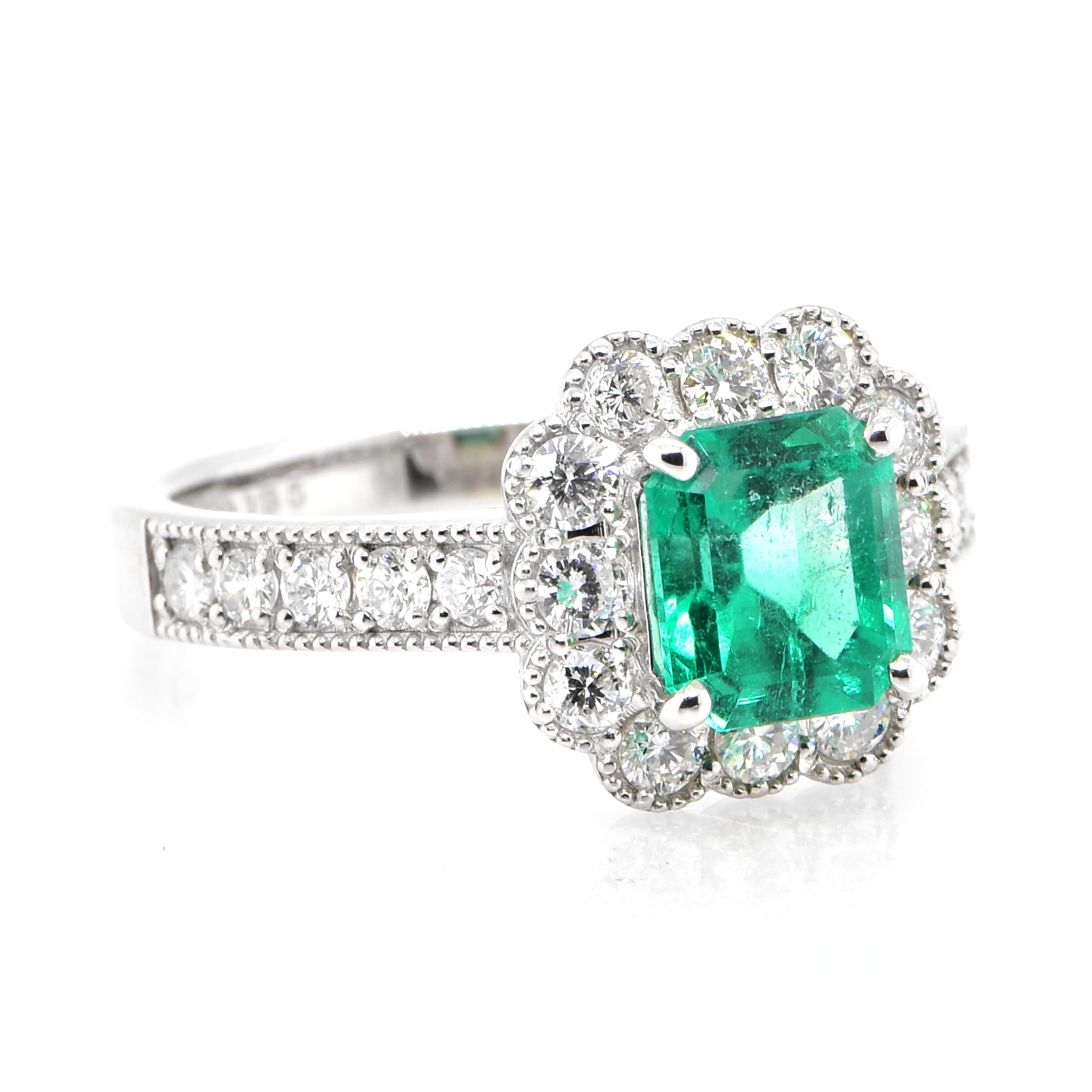 Modern 1.36 Carat Natural Colombian Emerald and Diamond Halo Ring set in Platinum For Sale