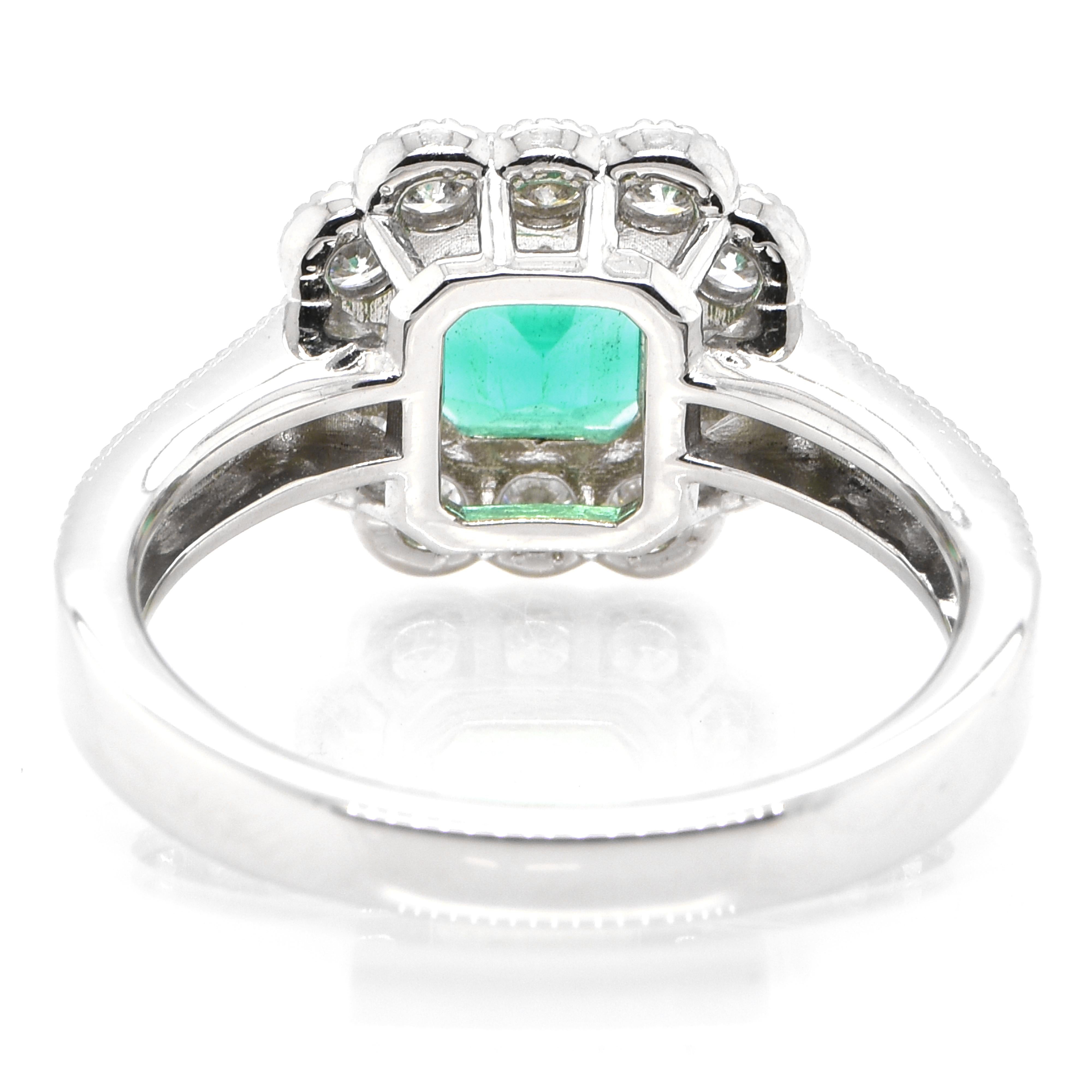 Women's 1.36 Carat Natural Colombian Emerald and Diamond Halo Ring set in Platinum For Sale